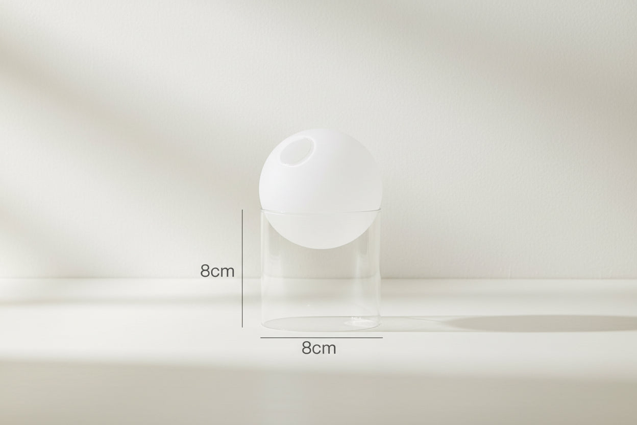White spherical object with dimensions labeled on a white background