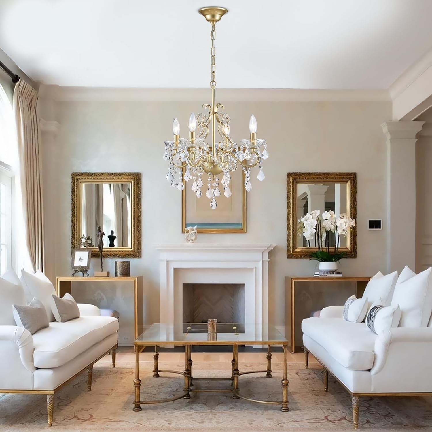 Elegant living room with white sofas, a chandelier, and decorative elements.