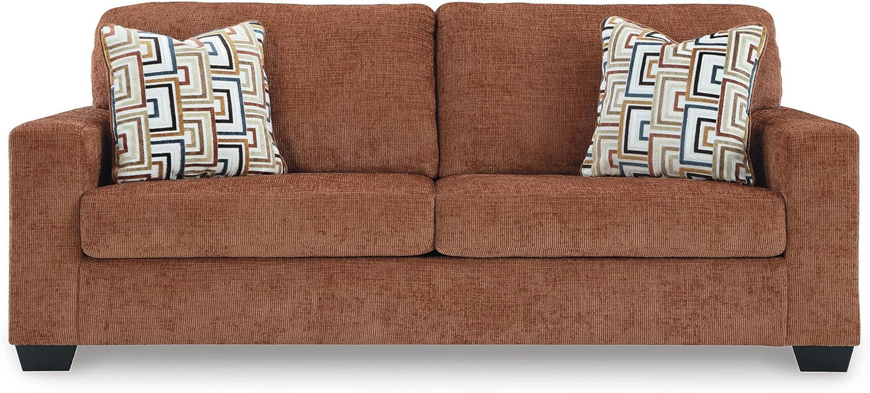 Brown sofa with patterned cushions on a white background