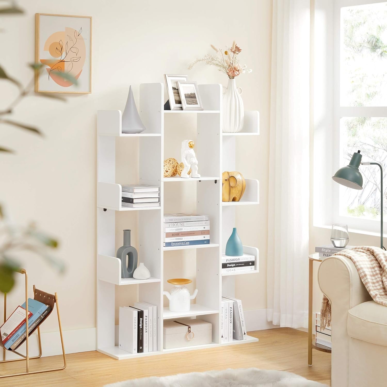 White bookshelf in a room with decor items and a chair.
