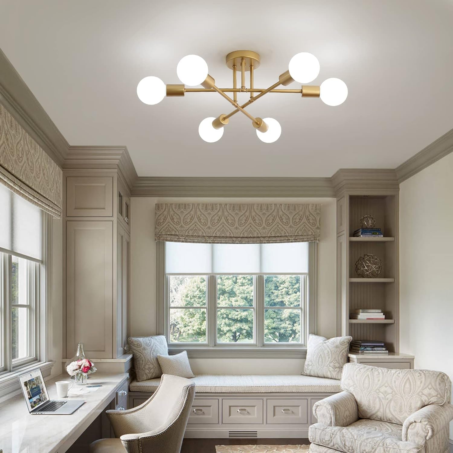 Modern chandelier in a stylish living room with decor elements.