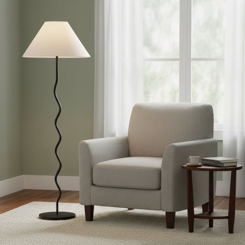 Floor lamp with a wavy black base and beige lampshade on a white background