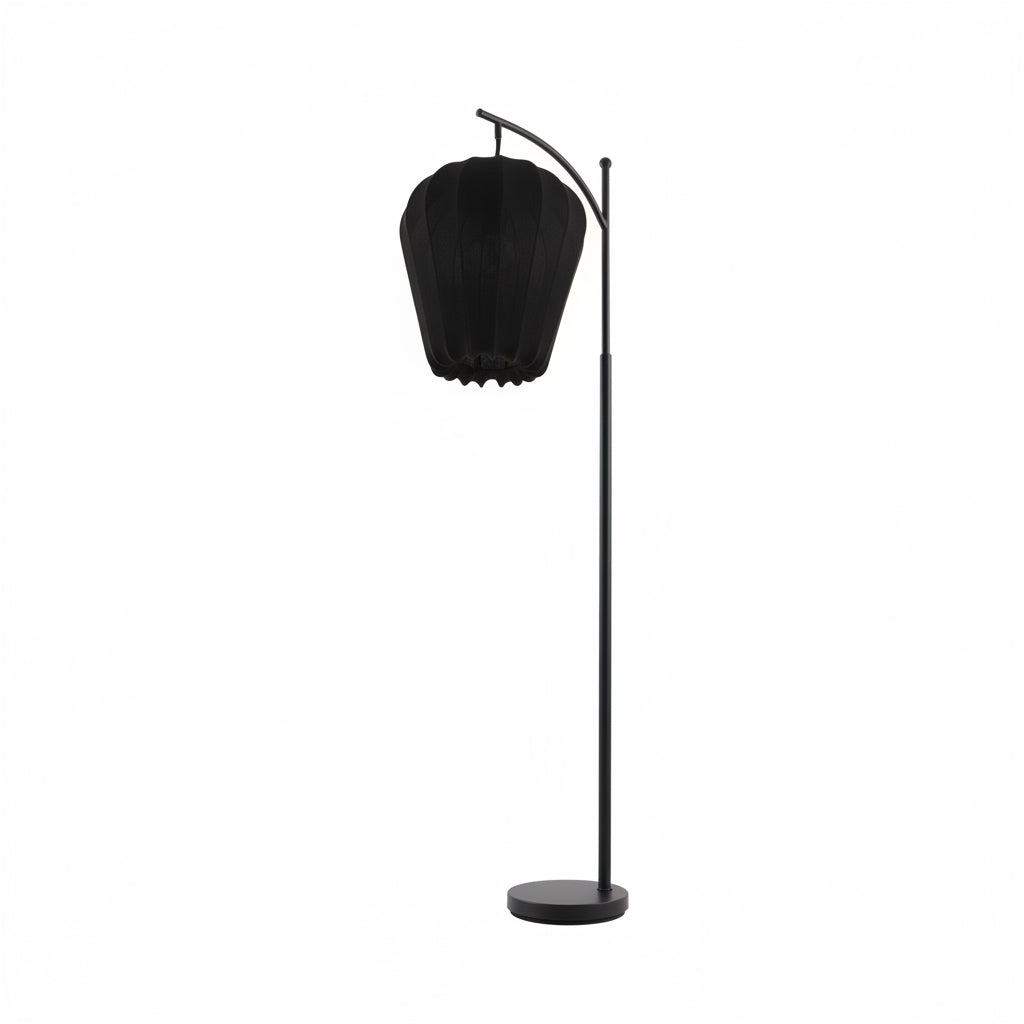 Black lampshade on a stand against a white background