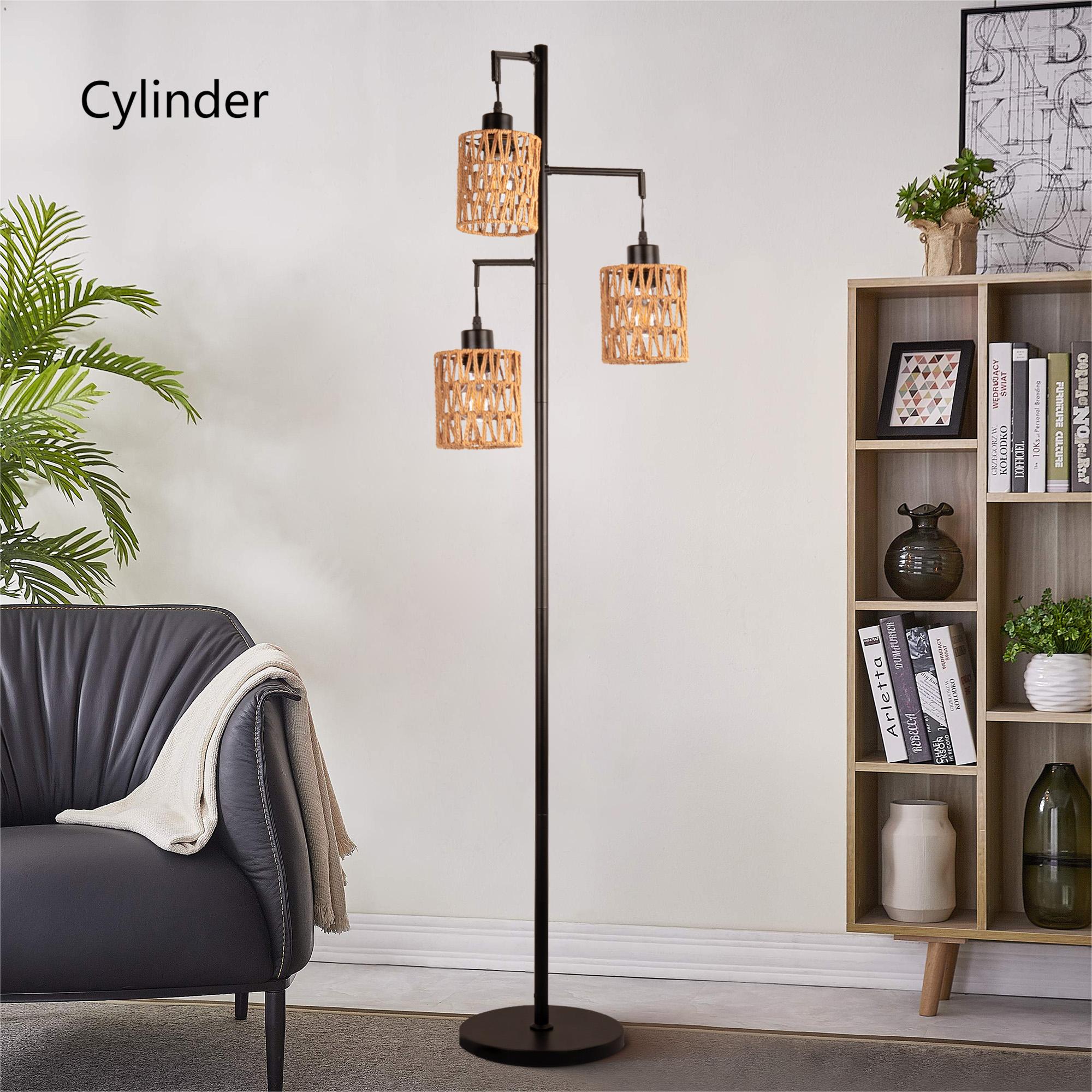 Floor lamp with cylindrical lampshades in a living room setting.