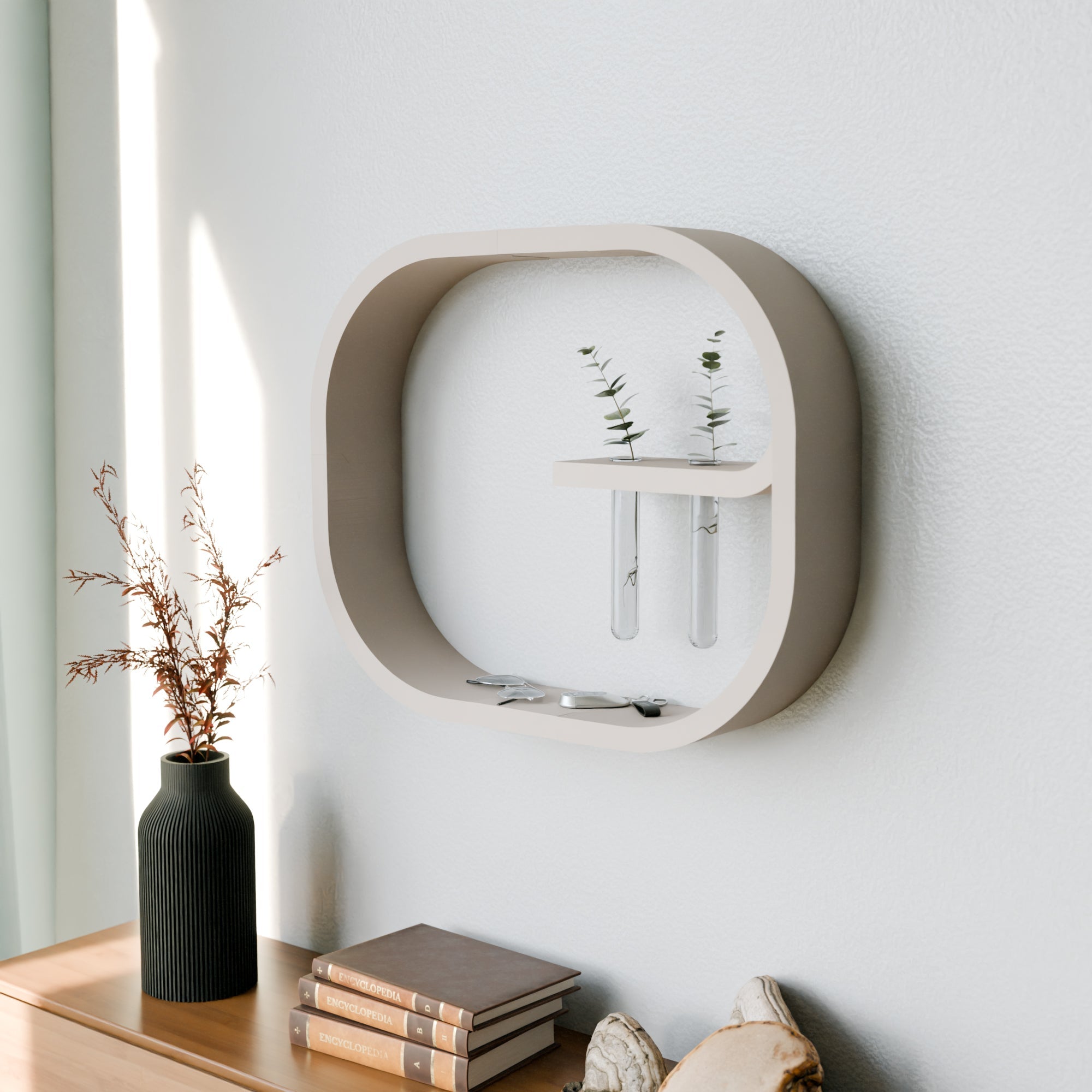 Decorative wall shelf with plants and a vase on a light-colored wall.