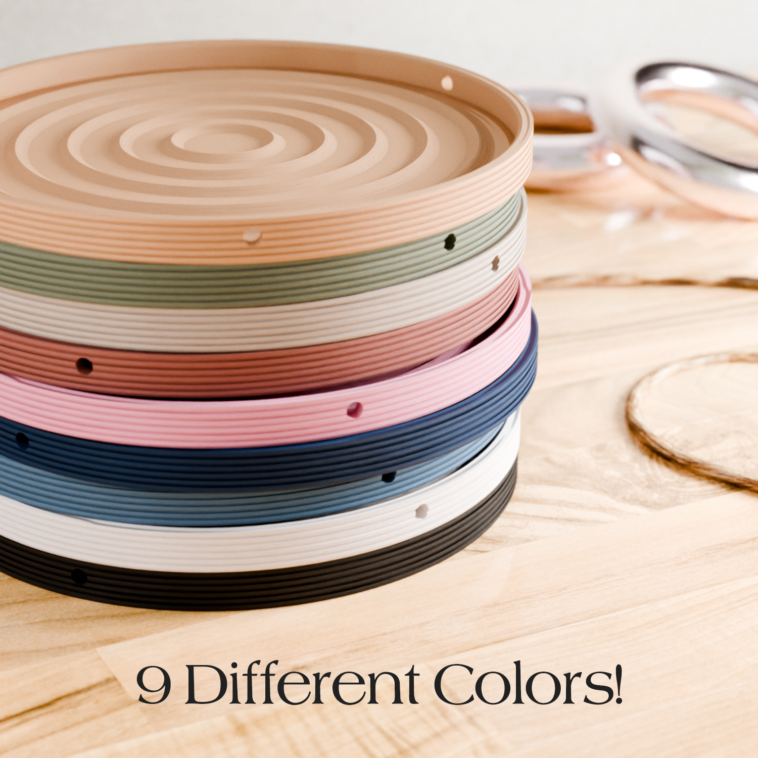 Stack of colorful circular objects on a wooden surface with text '9 Different Colors'.
