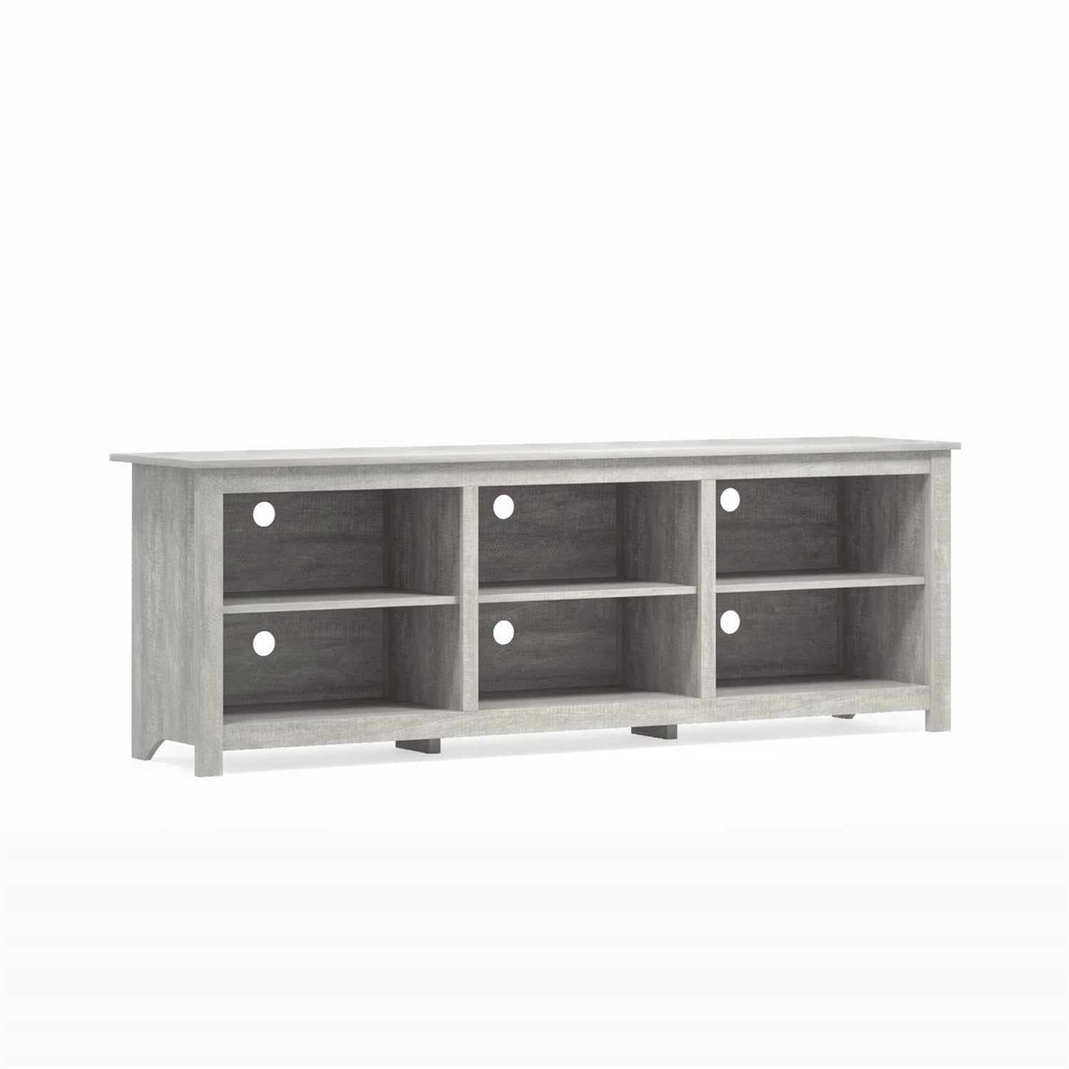 Wooden entertainment console with multiple shelves on a white background