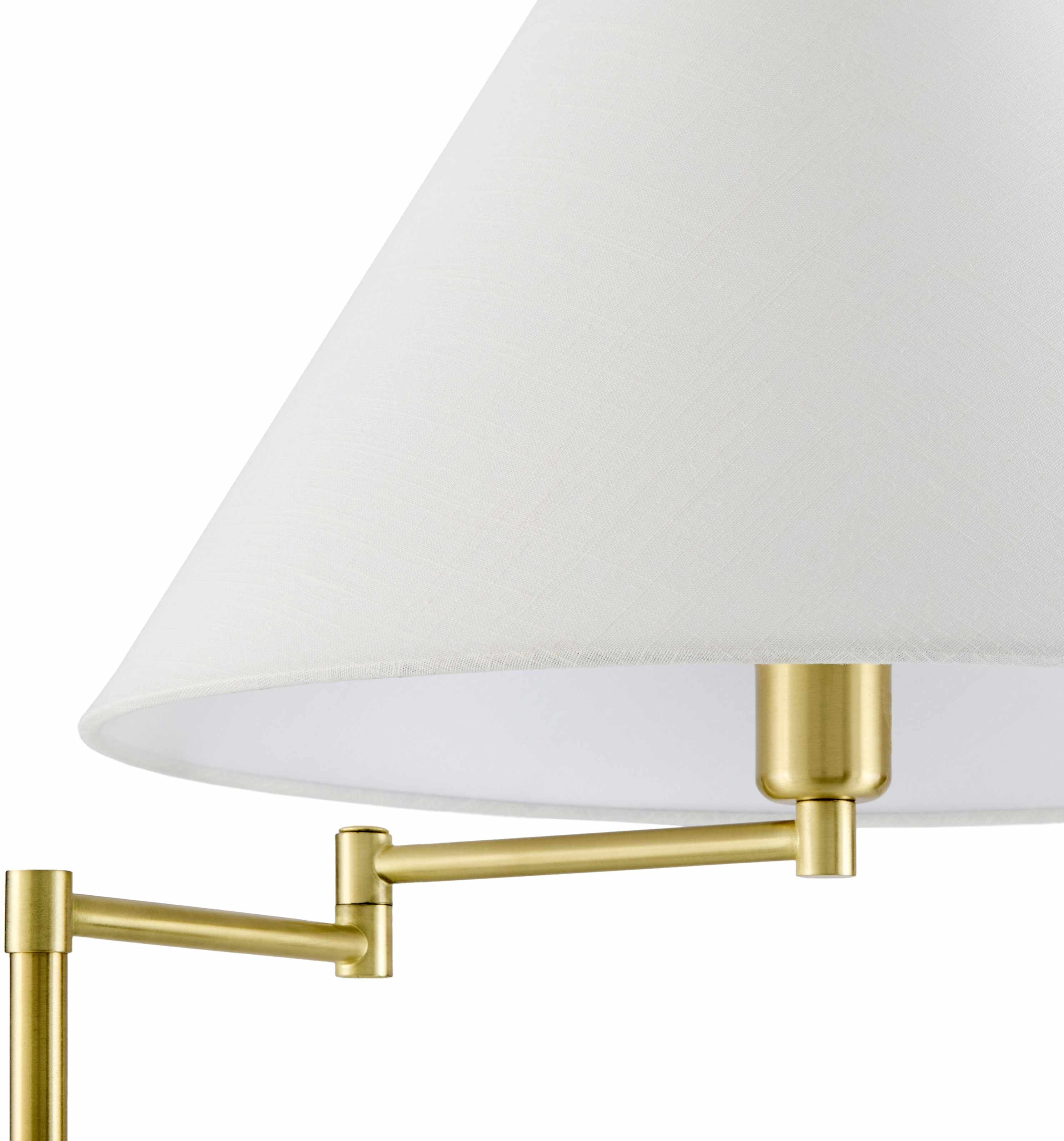Wall-mounted lamp with white shade and gold arm on a white background
