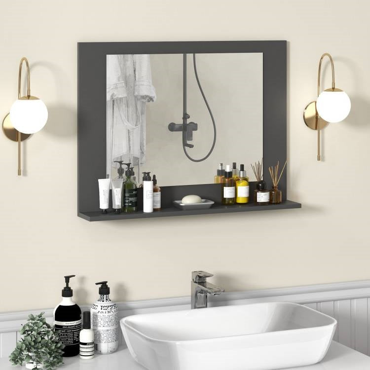Bathroom setup with a mirror, shelves, and various toiletries on a light-colored wall.