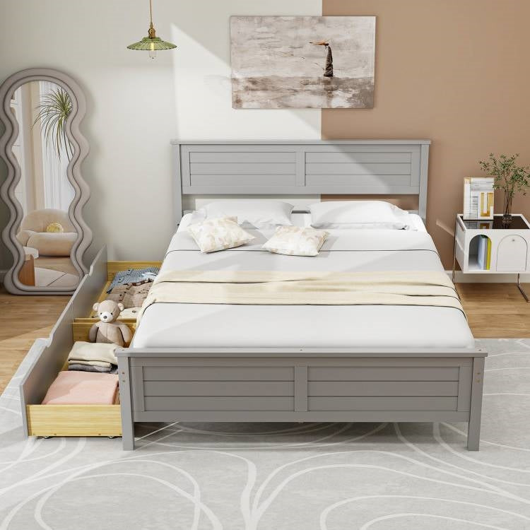 Gray wooden bed in a bedroom setting with decor elements.