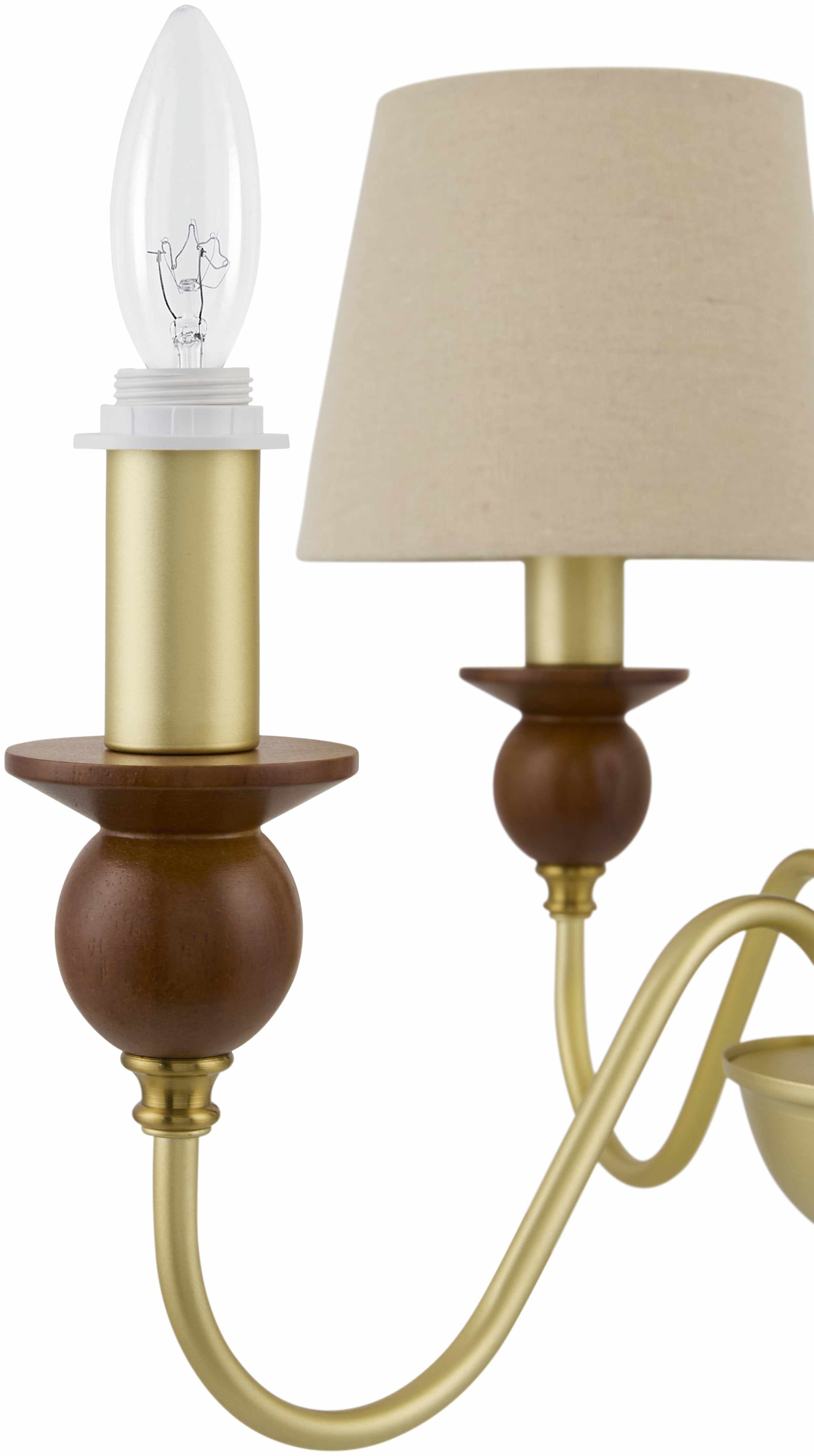 Decorative wall sconce with wooden and brass finish on a white background