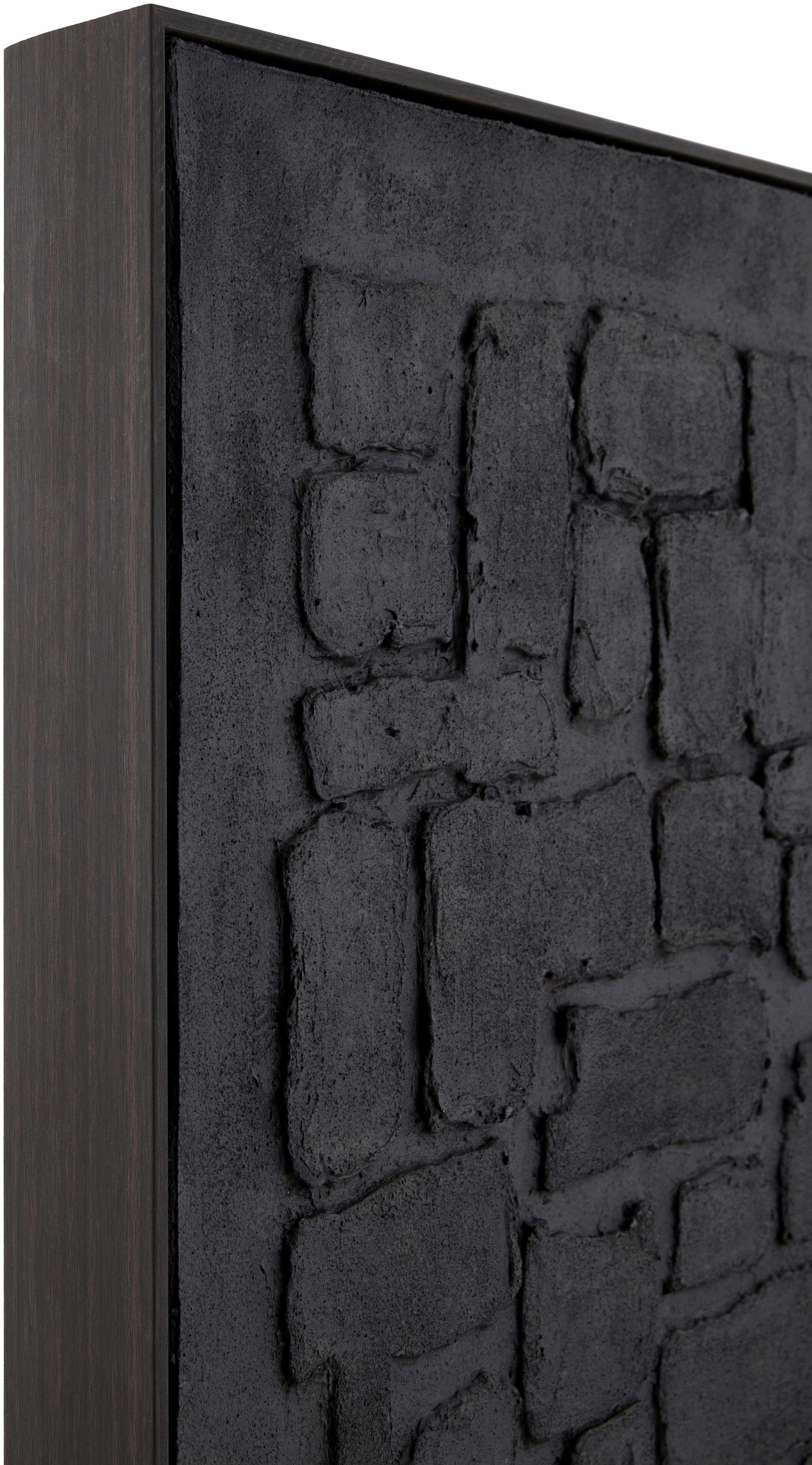 Textured black panel with brick-like pattern