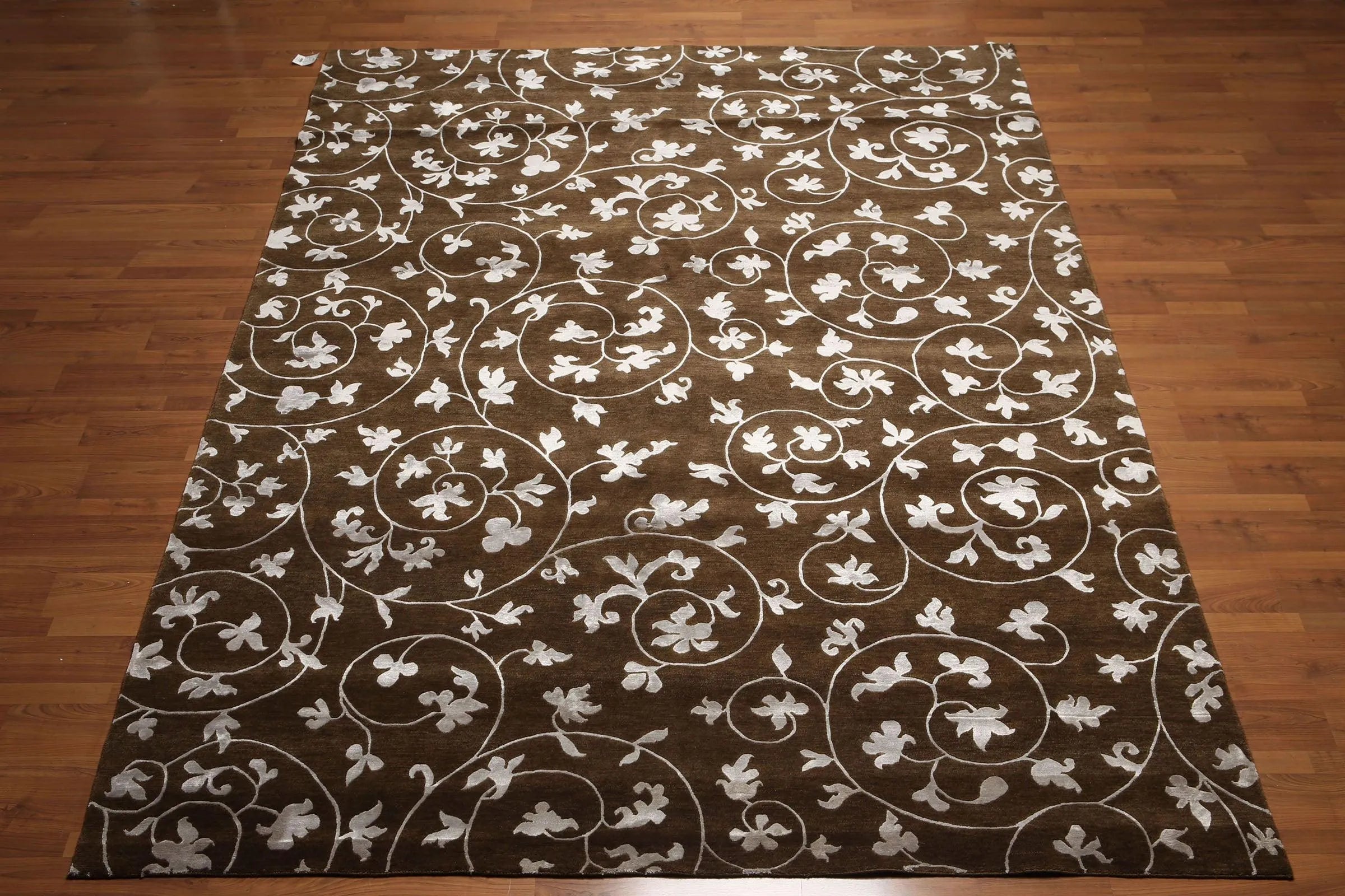 Floral patterned rug on a wooden floor