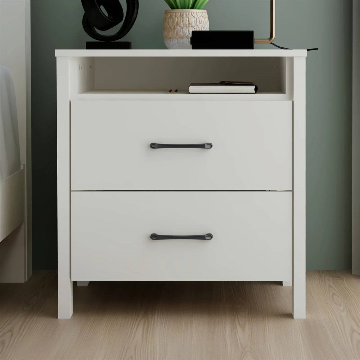 White nightstand with two drawers in a room setting