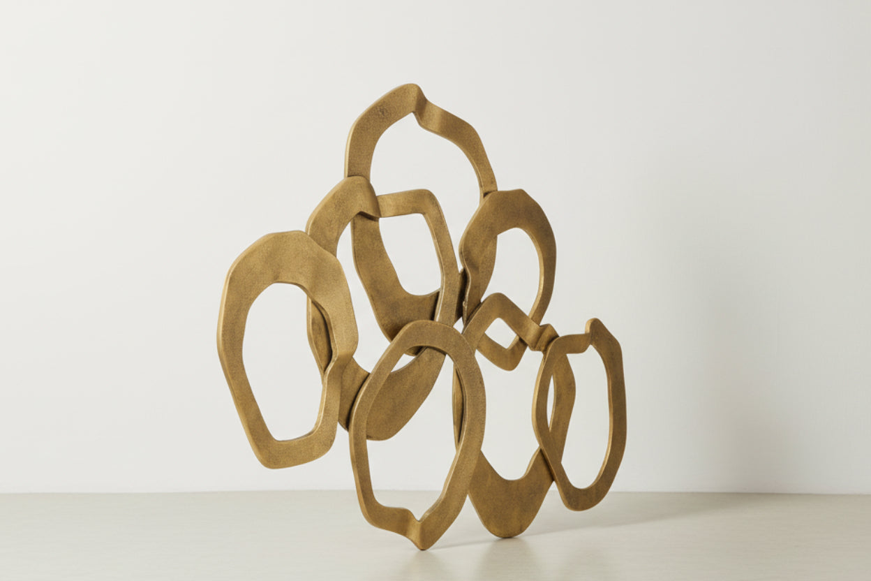 Gold abstract decorative item on a white background