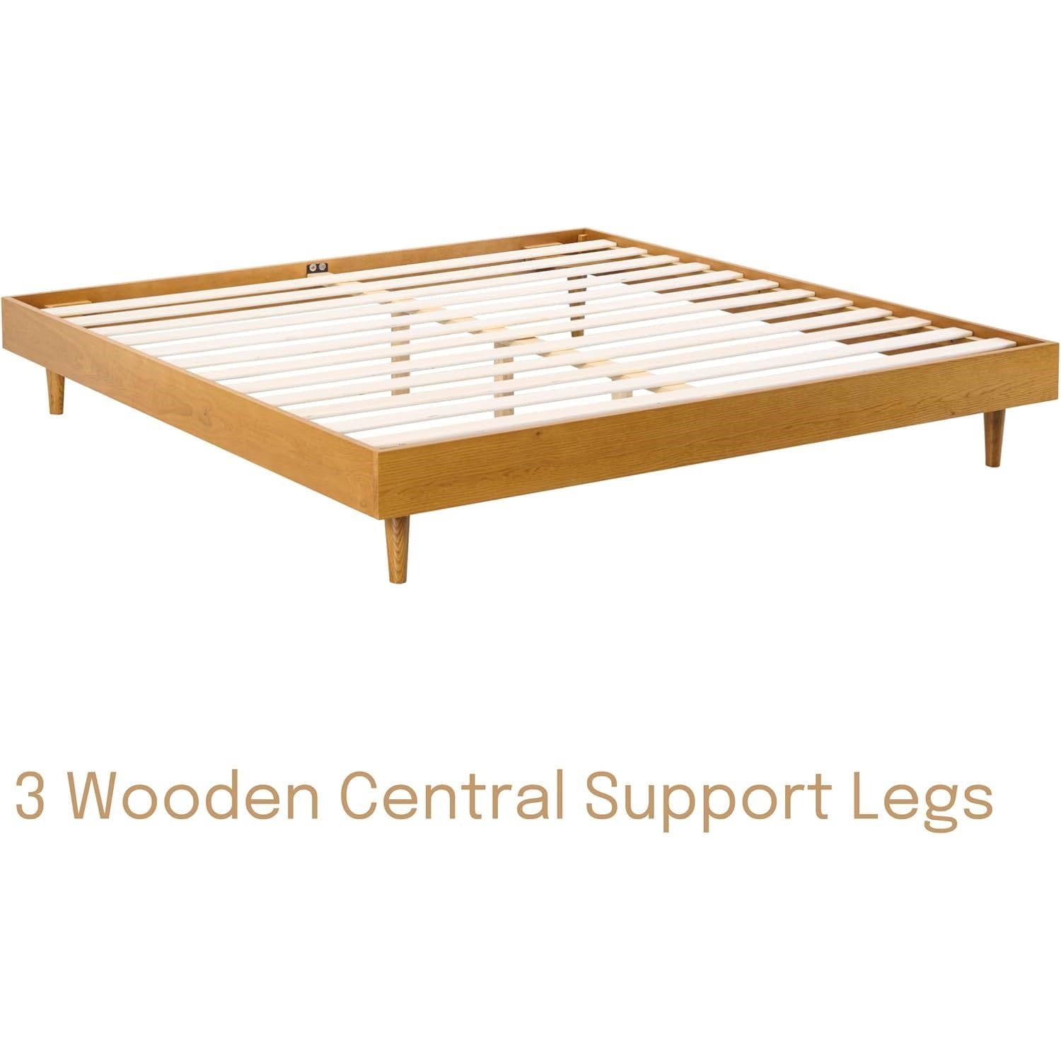 Wooden bed frame with slats on a white background