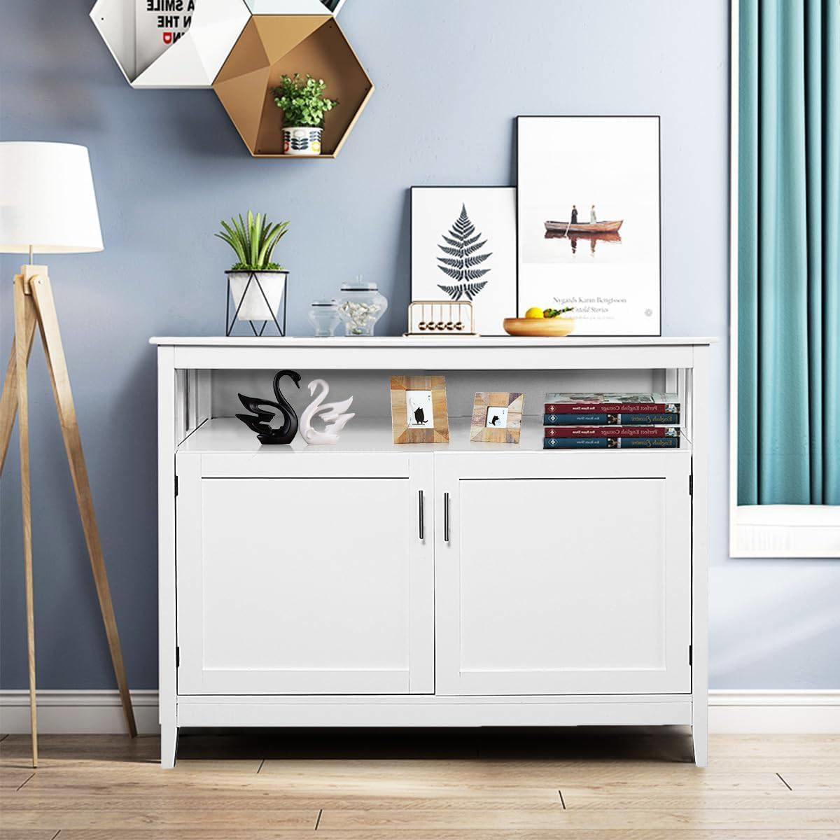 White cabinet with decorative items against a blue wall
