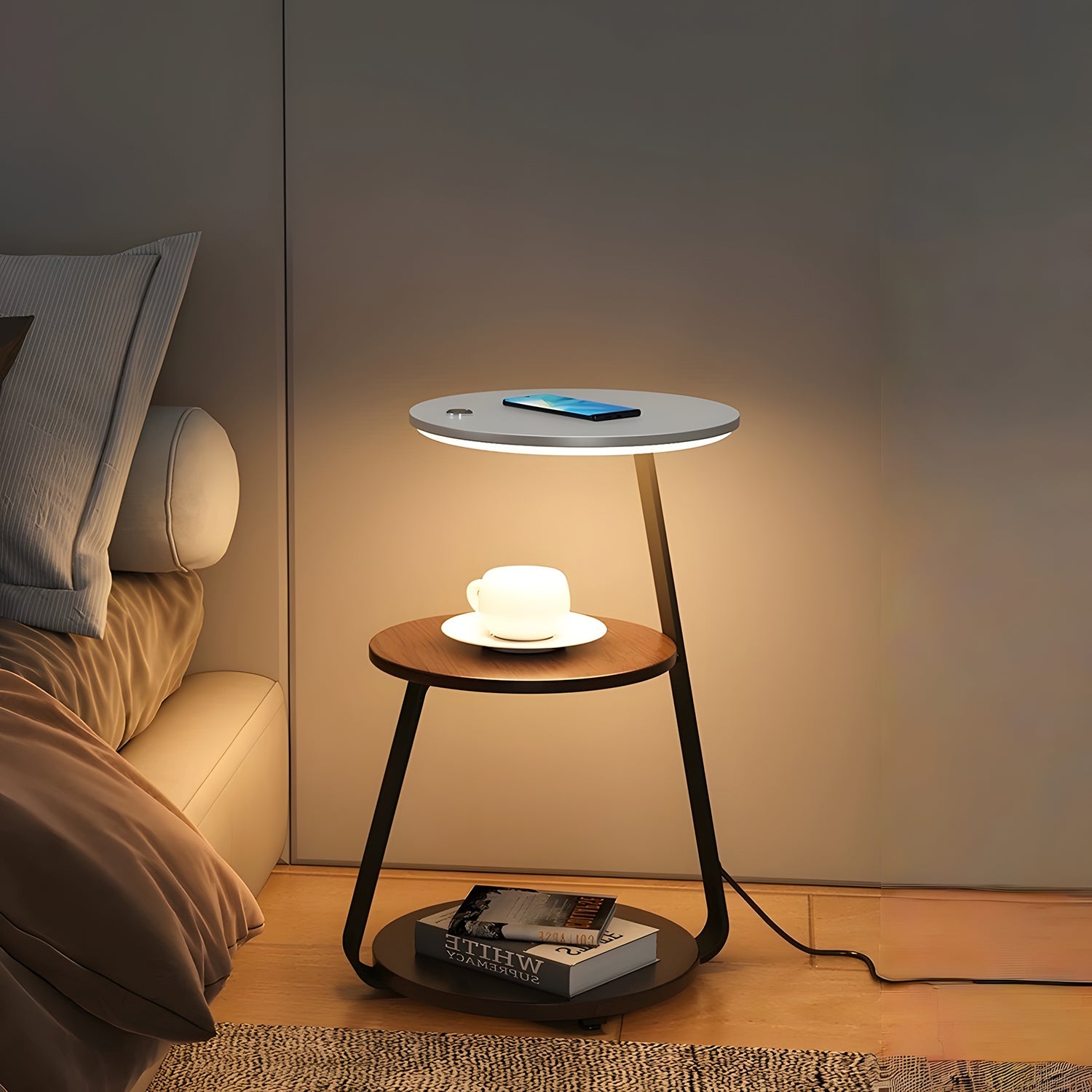 Modern side table with a lamp and phone next to a bed in a bedroom setting