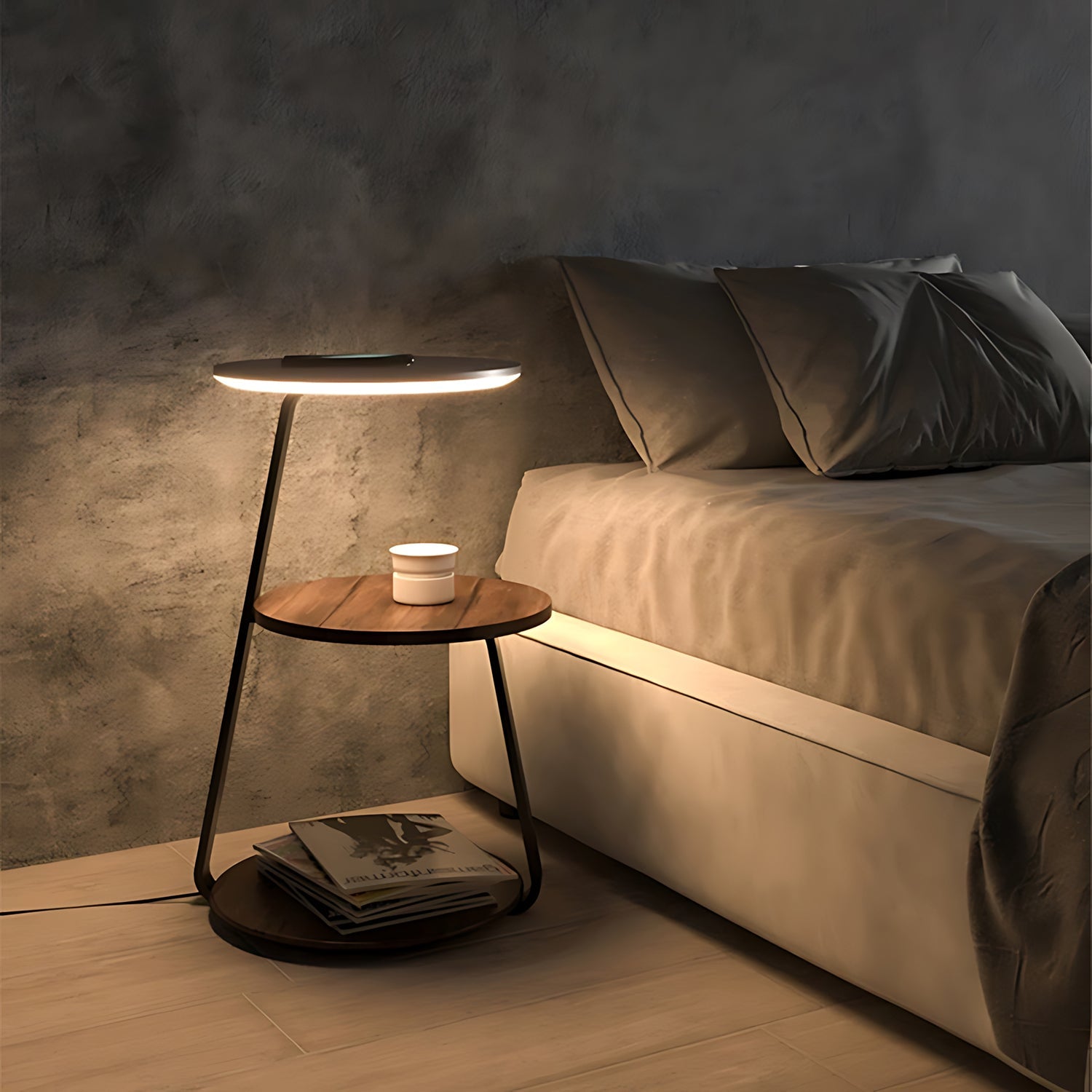 Modern side table with a lamp next to a sofa in a dimly lit room.
