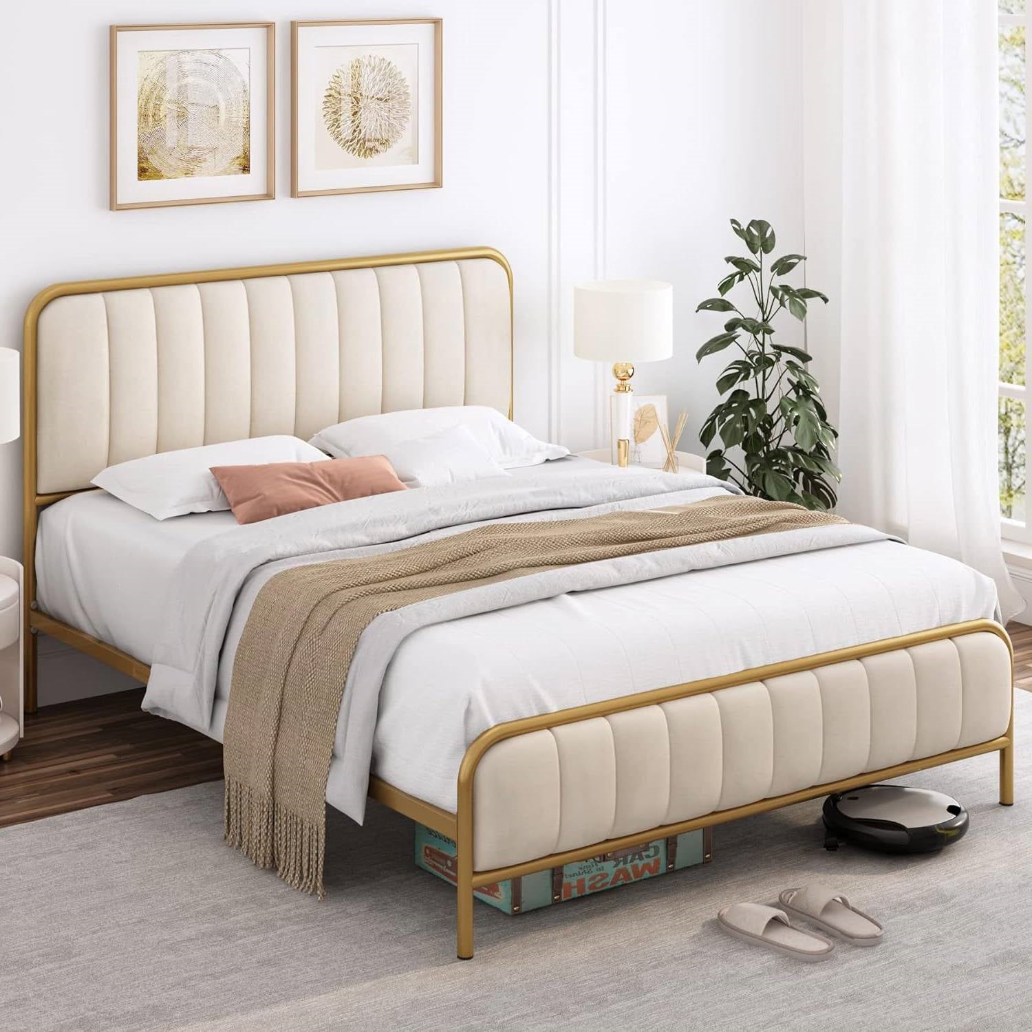 Beige upholstered bed with gold frame in a bedroom setting