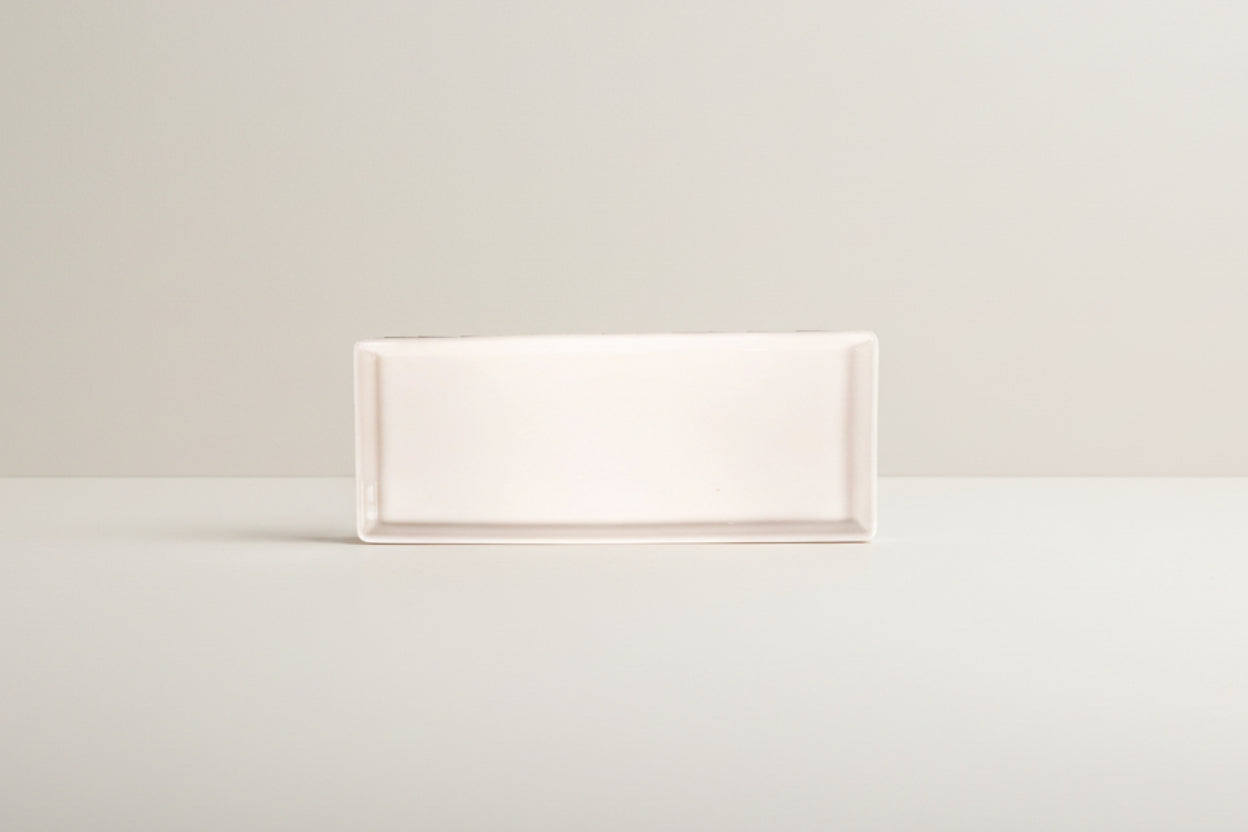 Rectangular white tile on a white background