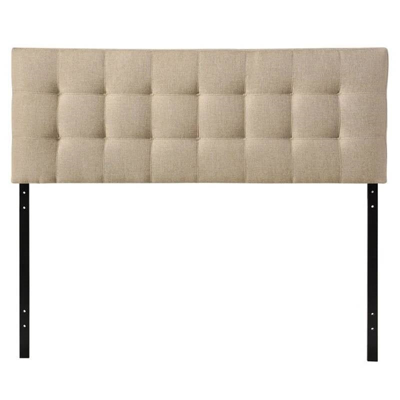 Beige tufted headboard with black metal legs on a white background