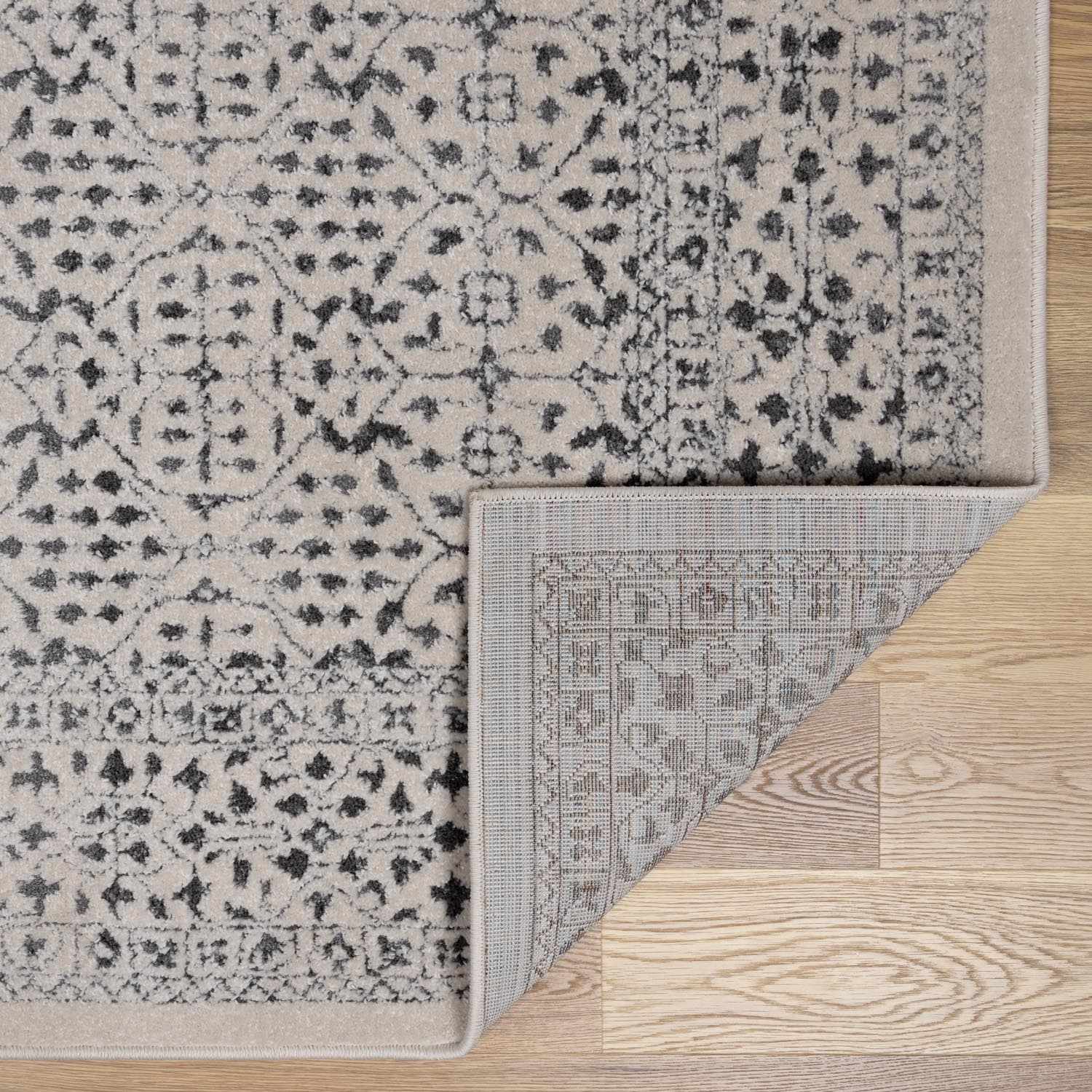Patterned rug on a wooden floor