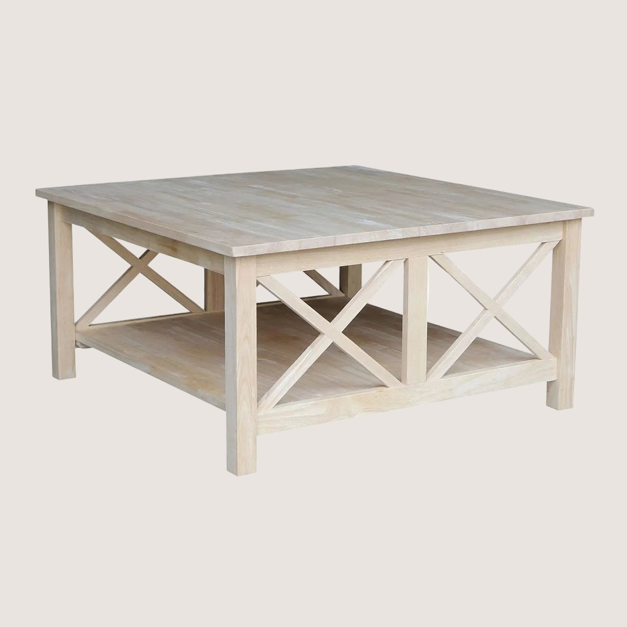 Light wood coffee table with X-shaped leg design on a white background