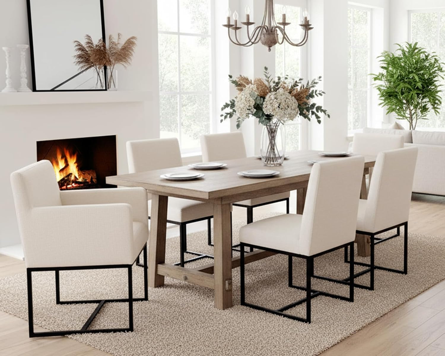 Dining room with a wooden table and white chairs, fireplace, and large windows.