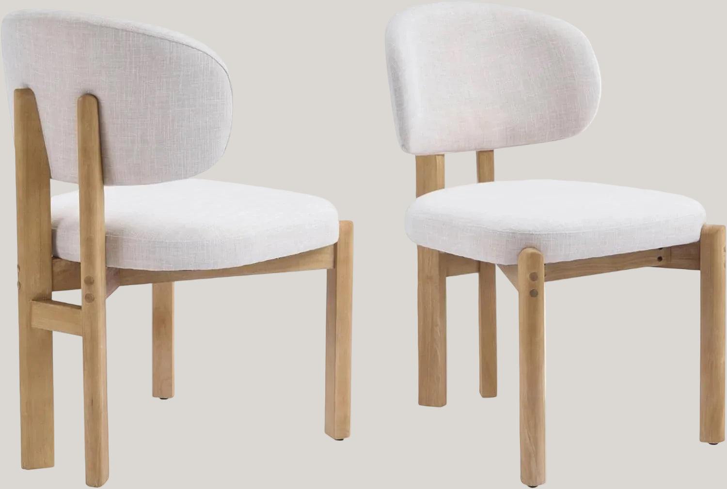 Two chairs with white cushioned seats and light wooden frames on a white background