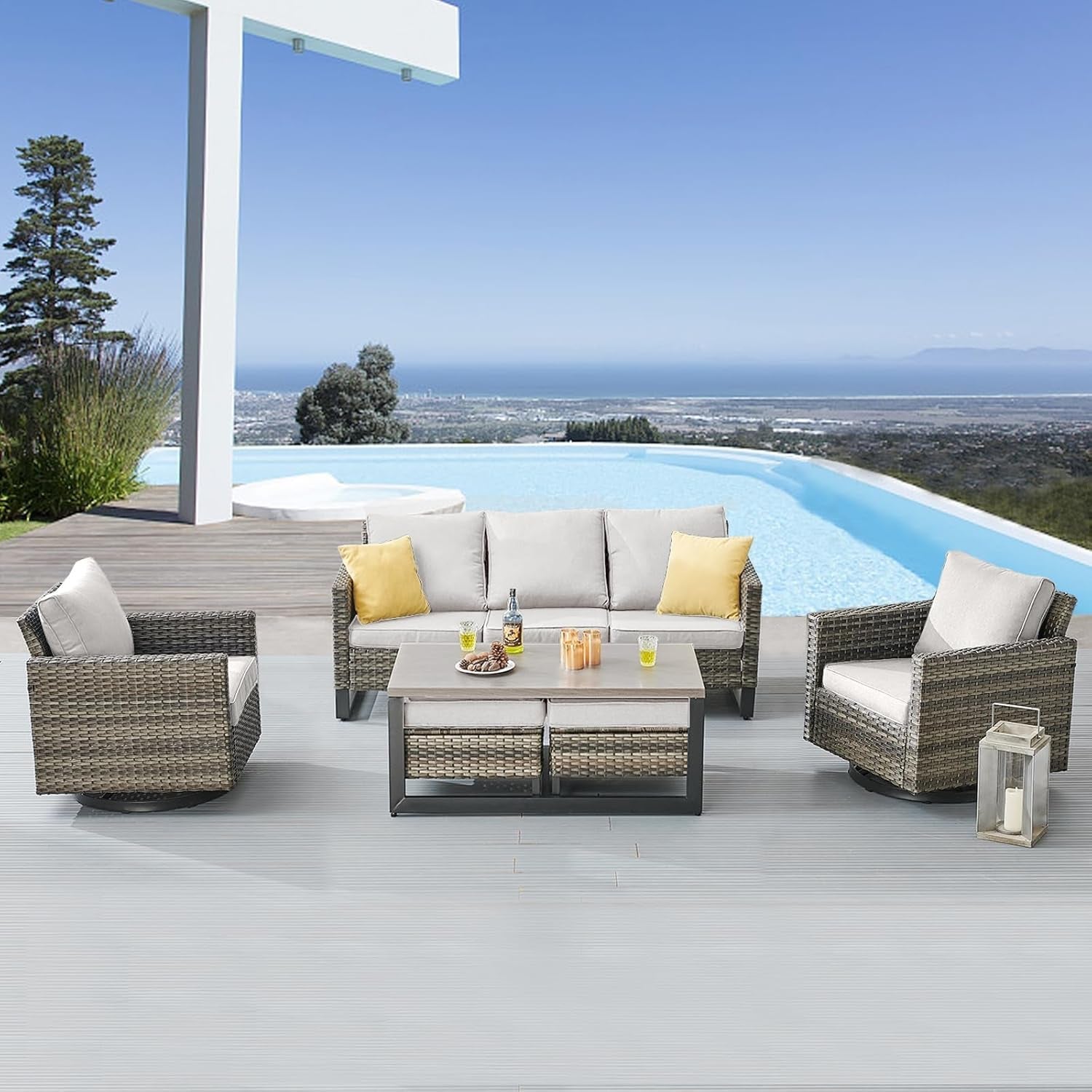 Outdoor patio furniture set with a pool and ocean view