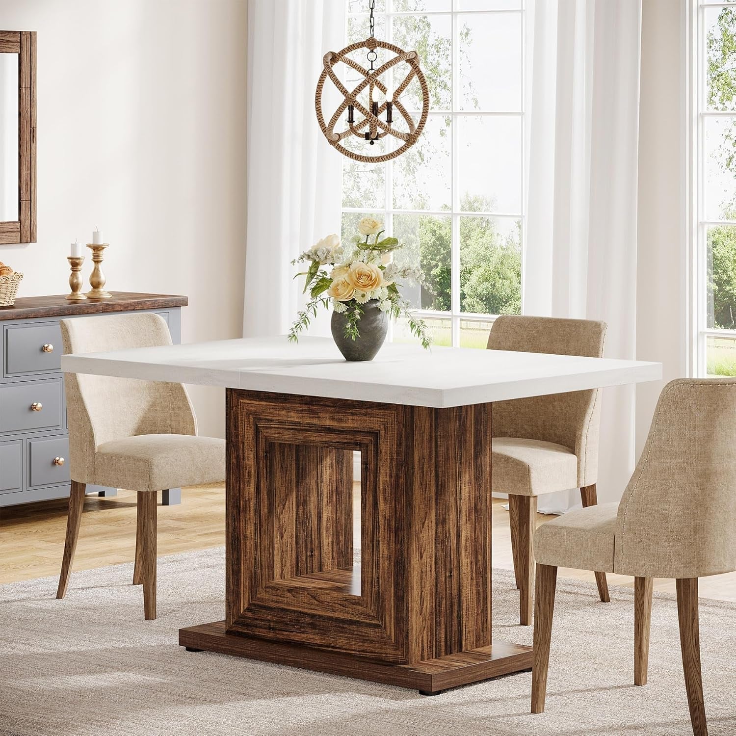 Dining room with a wooden table and chairs, featuring a decorative chandelier.