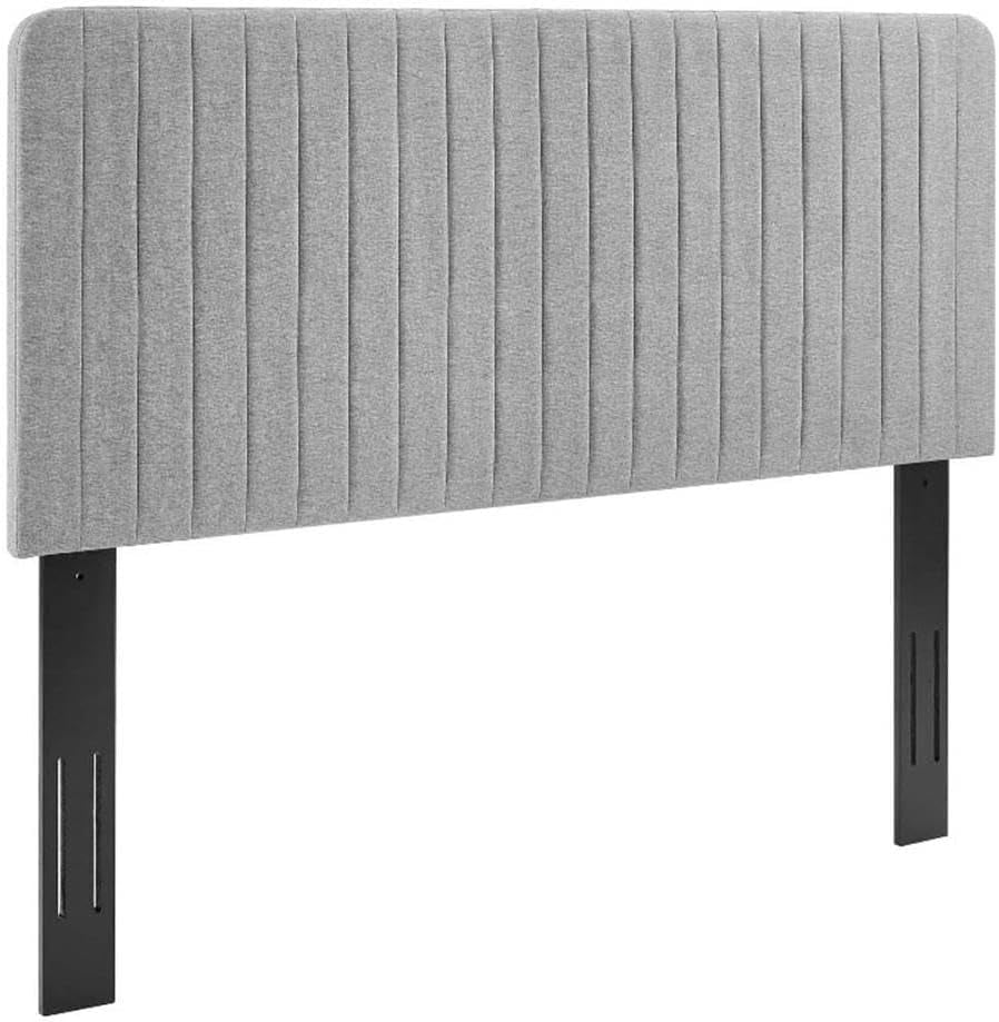 Gray upholstered headboard with black metal legs on a white background