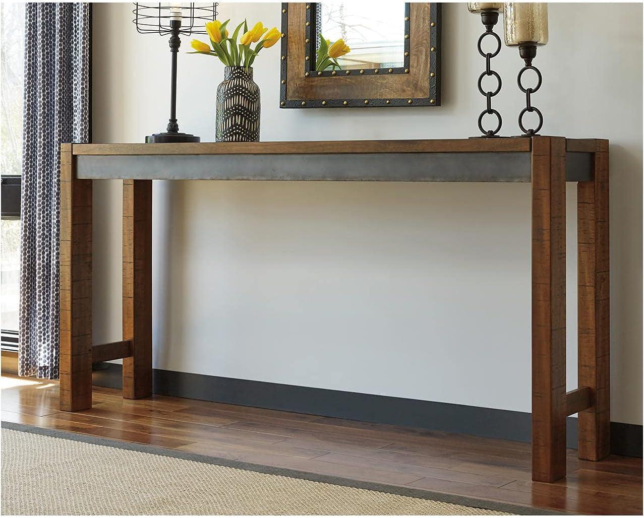 Wooden console table with decorative items against a wall.