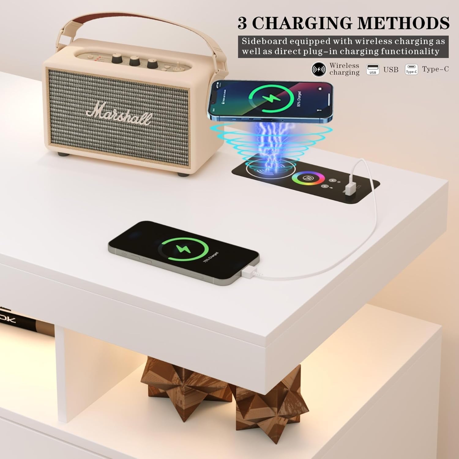 Marshall speaker on a white sideboard with wireless charging capabilities, including a smartphone, tablet, and headphones.