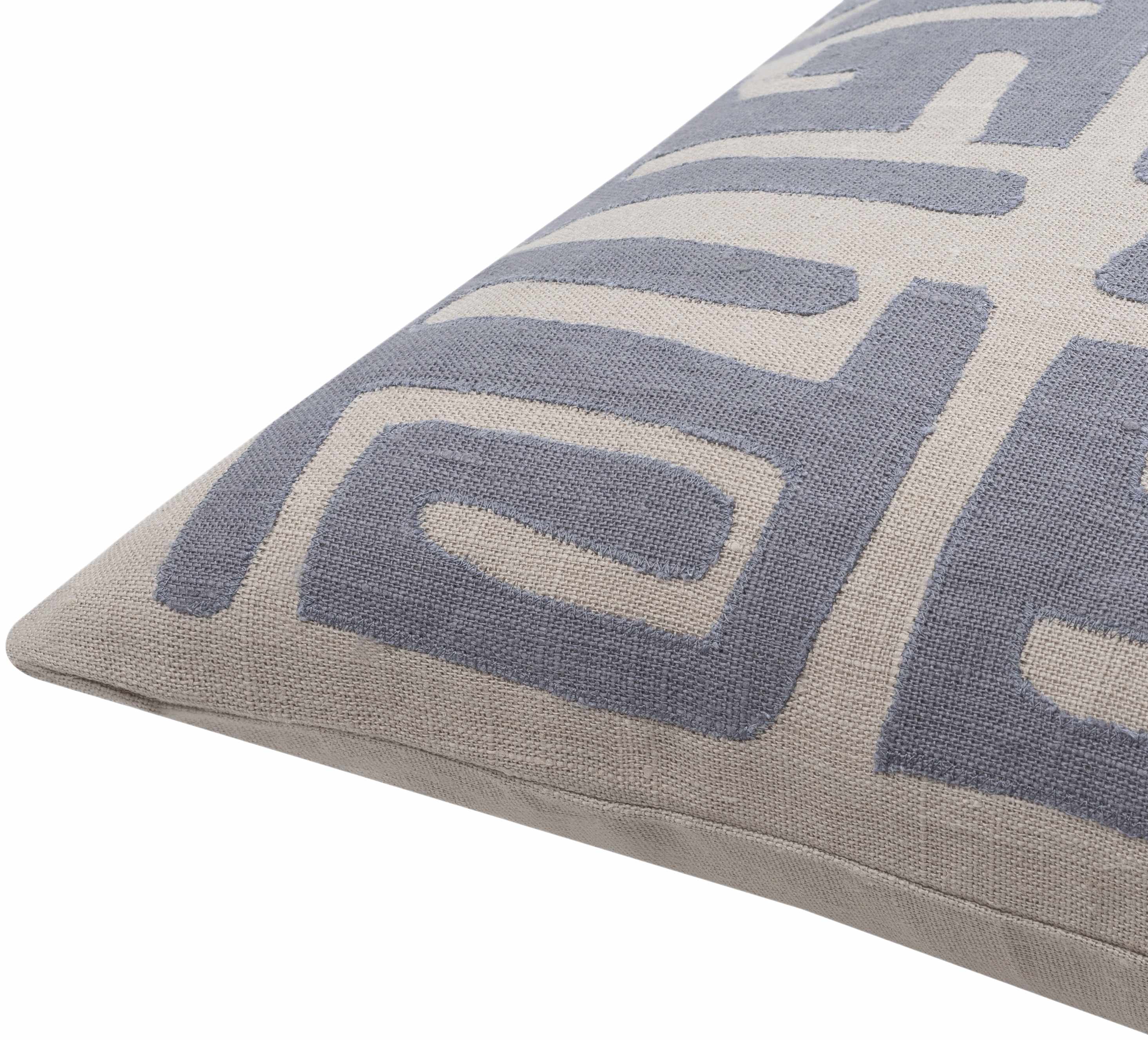 Gray pillow with geometric pattern on a white background