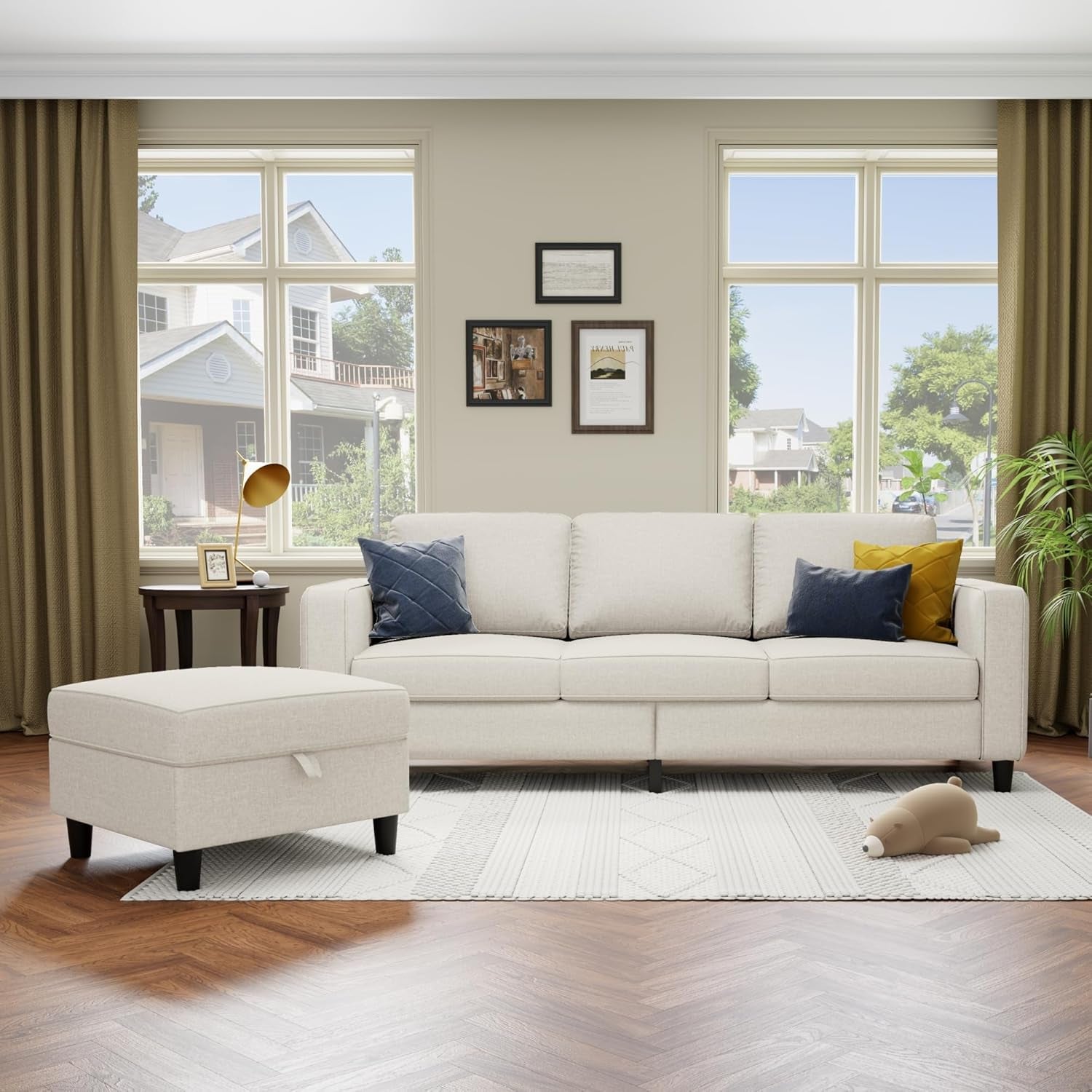 Living room with a white sectional sofa, ottoman, and decorative pillows.