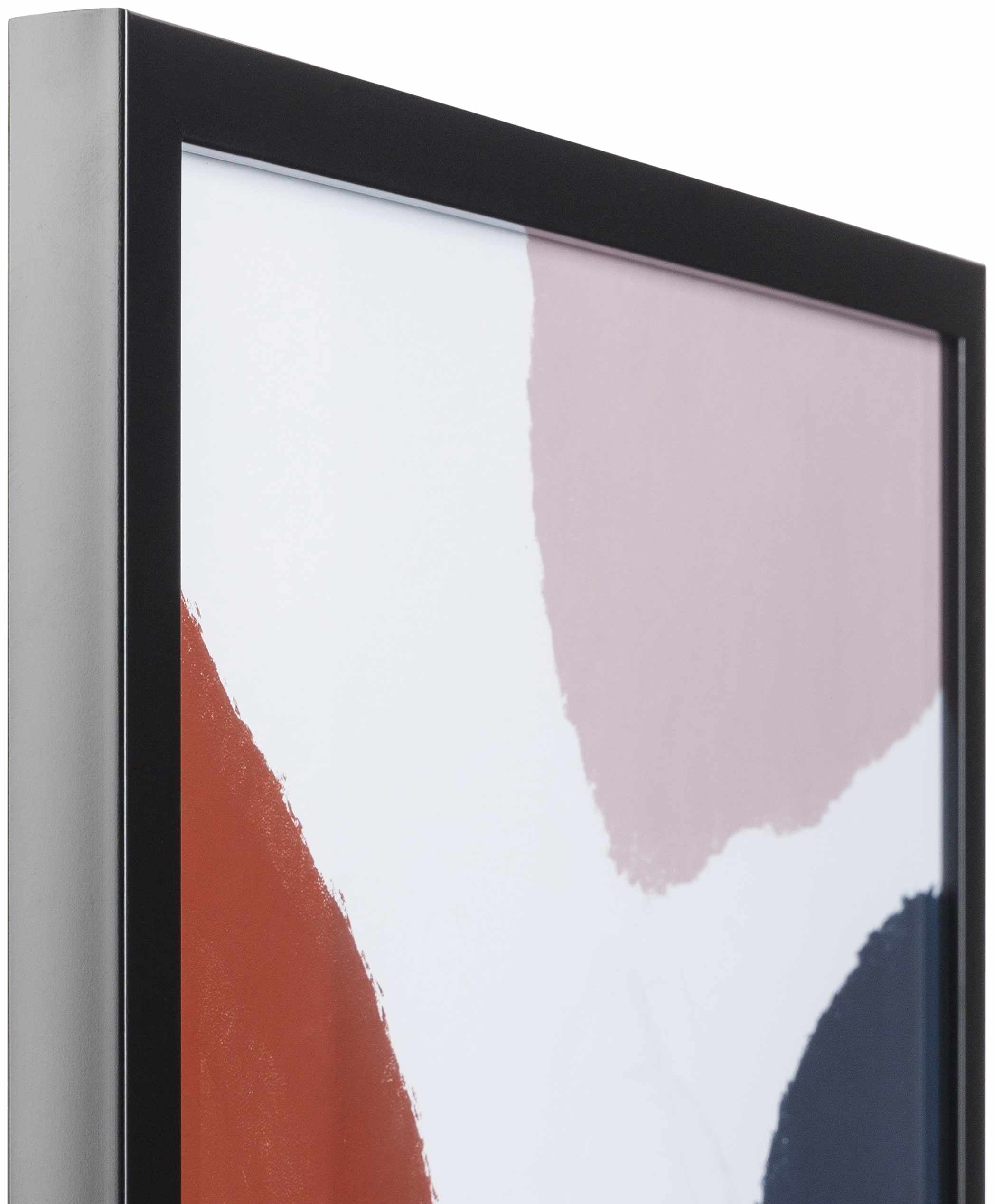 Close-up of a framed abstract art piece with colorful shapes on a white background