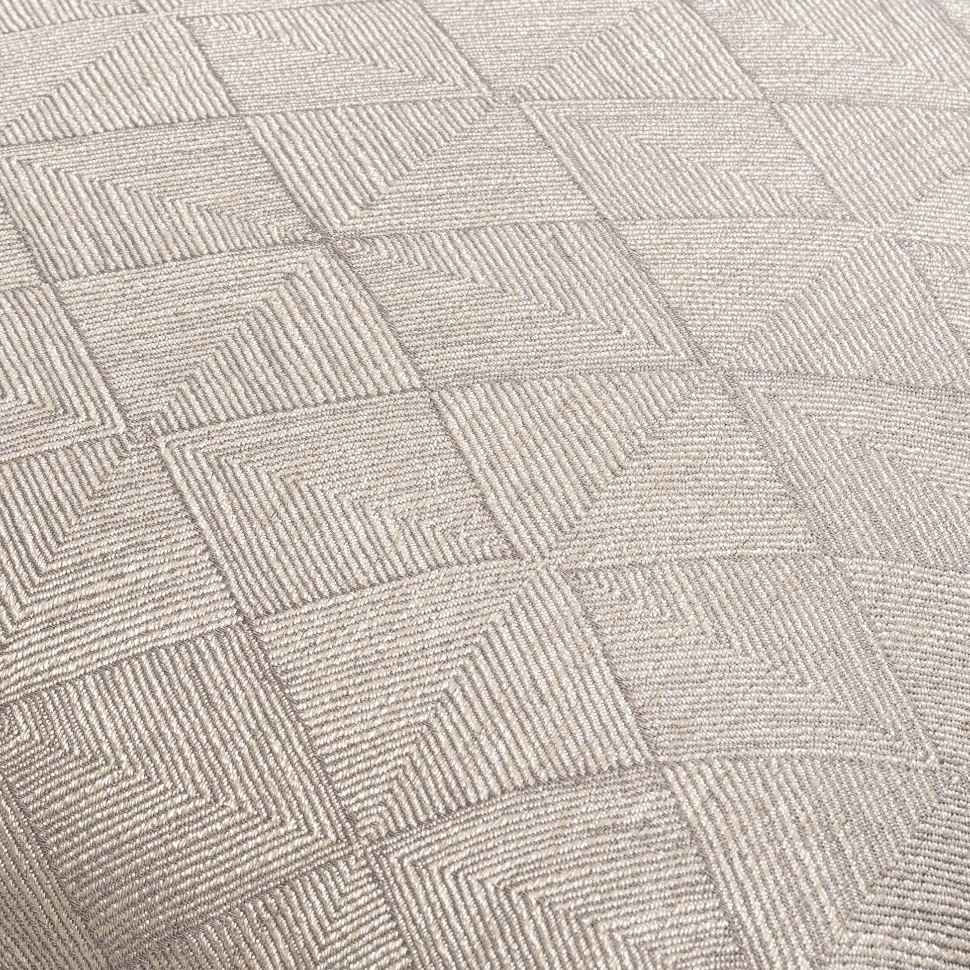 Patterned carpet with a geometric design in neutral tones