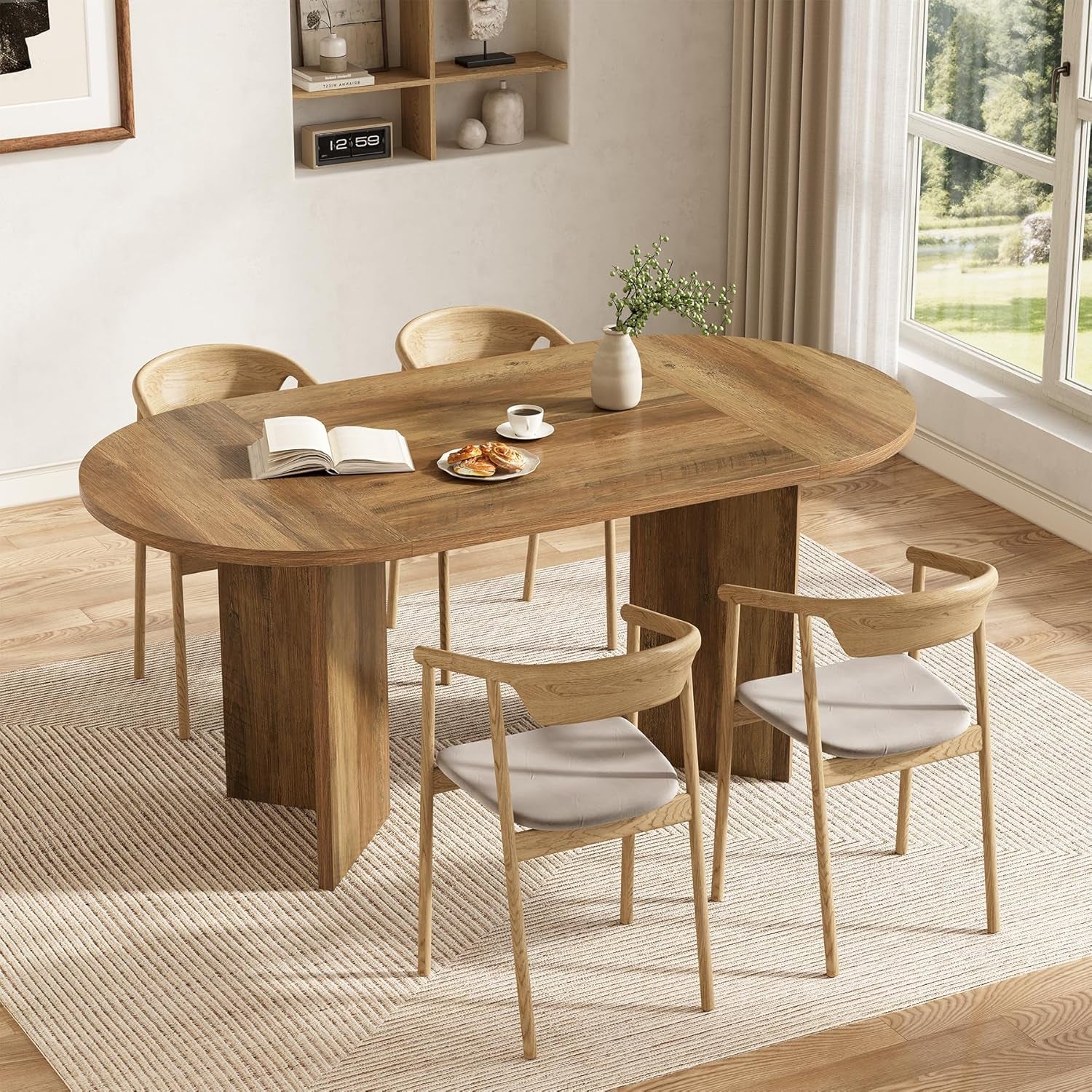 Wooden dining table with chairs in a bright room with large windows.