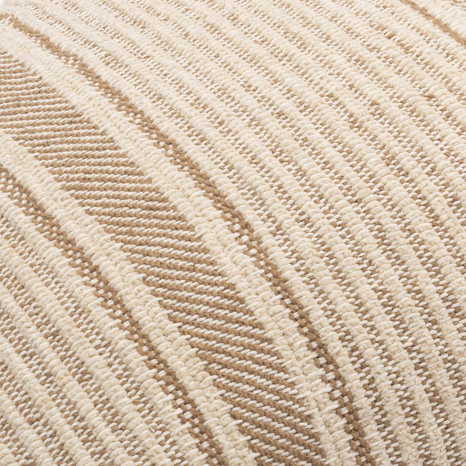 Close-up of a textured beige and brown fabric pattern