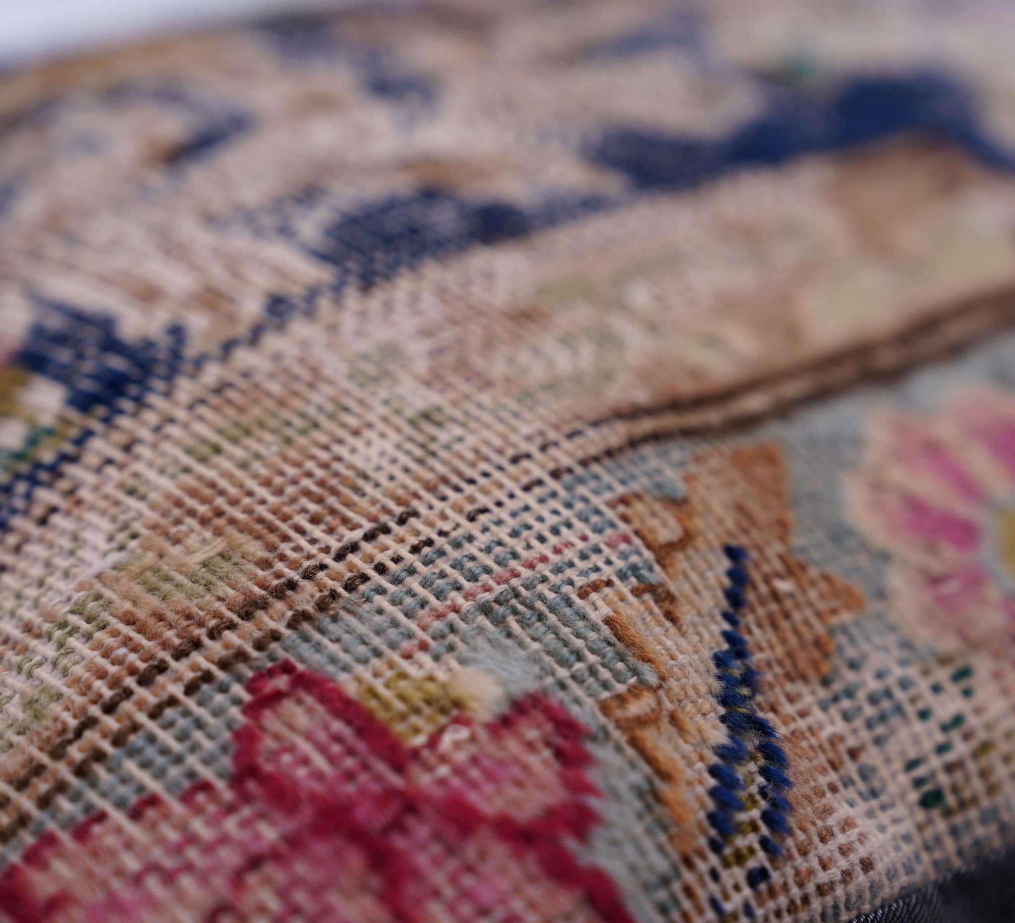 Close-up of a needlepoint canvas with floral patterns