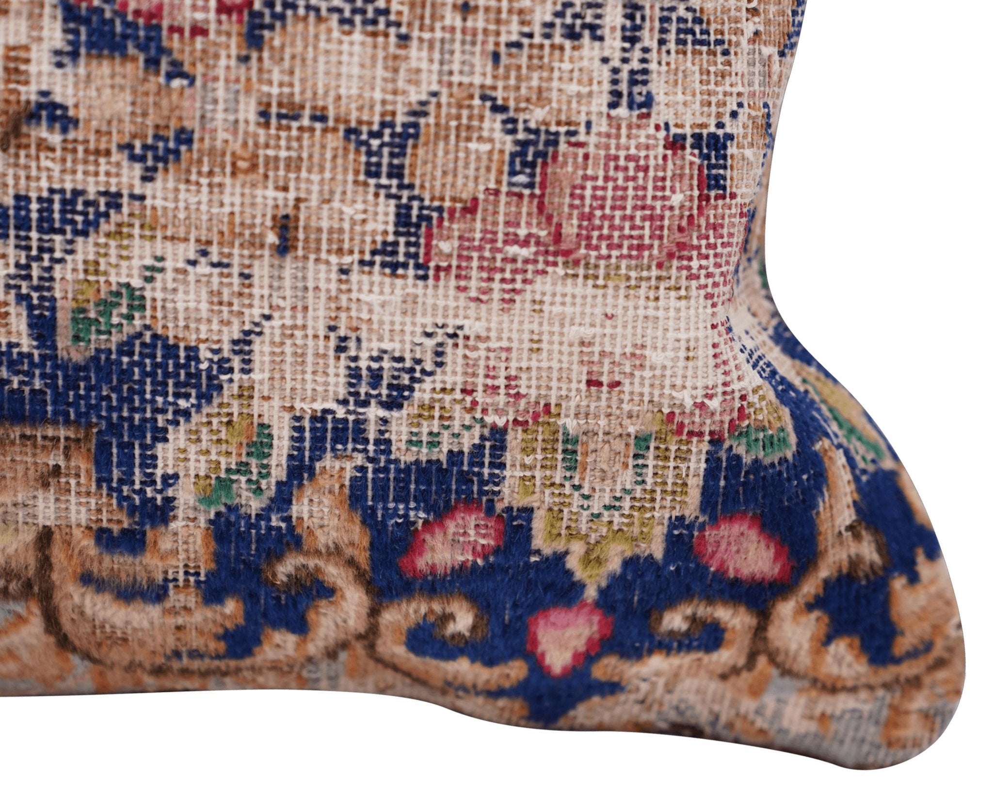 Close-up of a patterned fabric with intricate designs on a white background