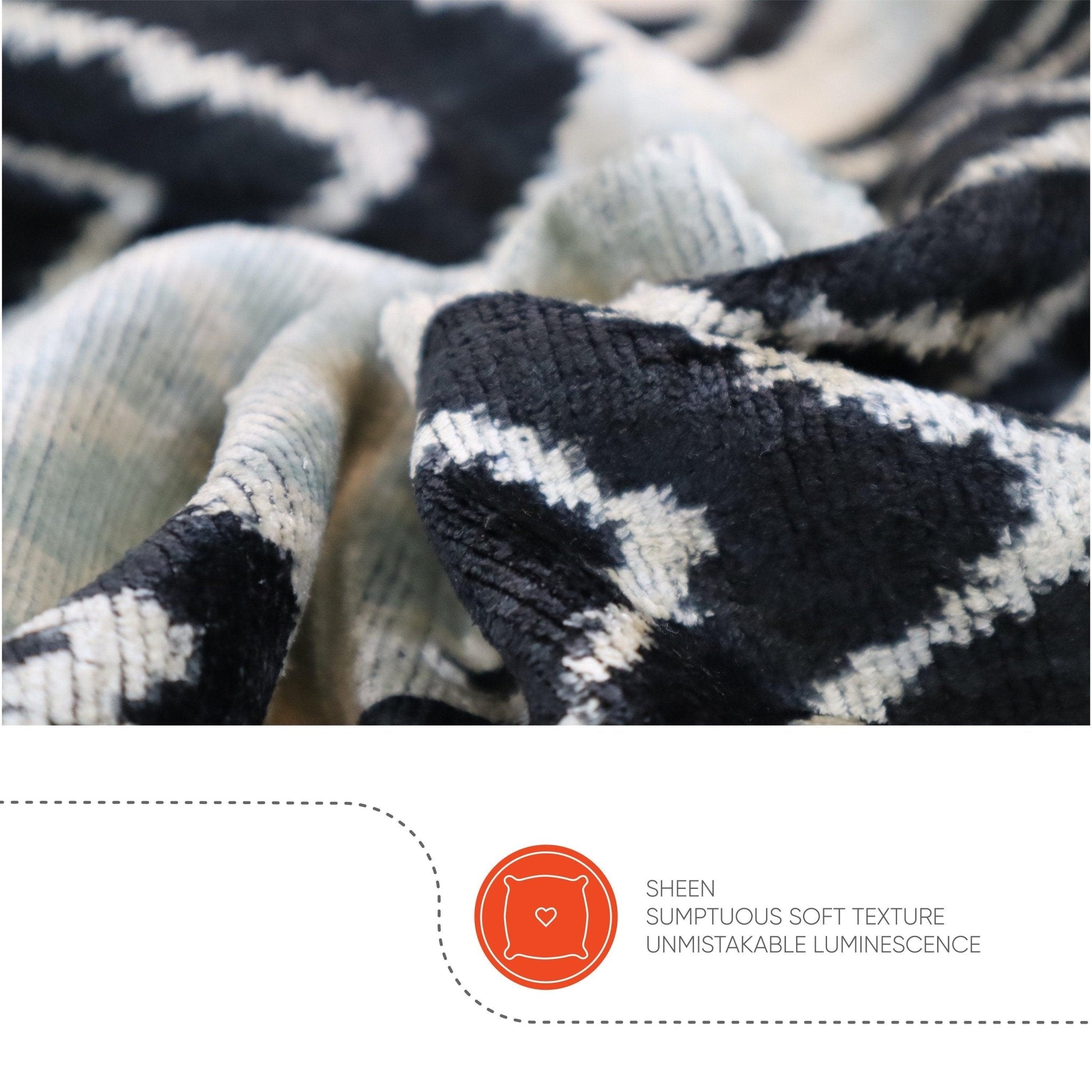 Close-up of textured fabric with black and white pattern, featuring a brand logo and text.