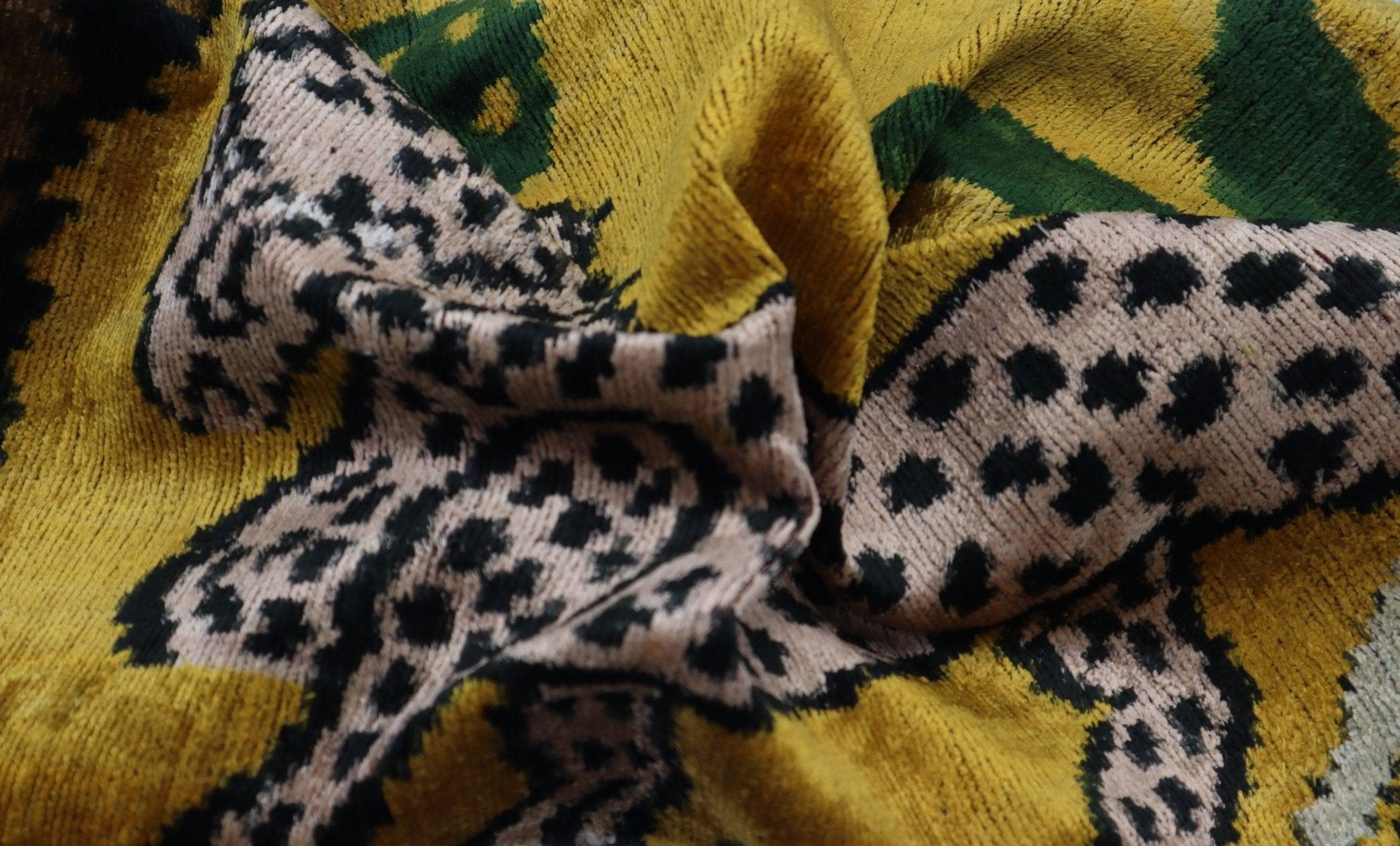 Leopard print sock on a patterned fabric background