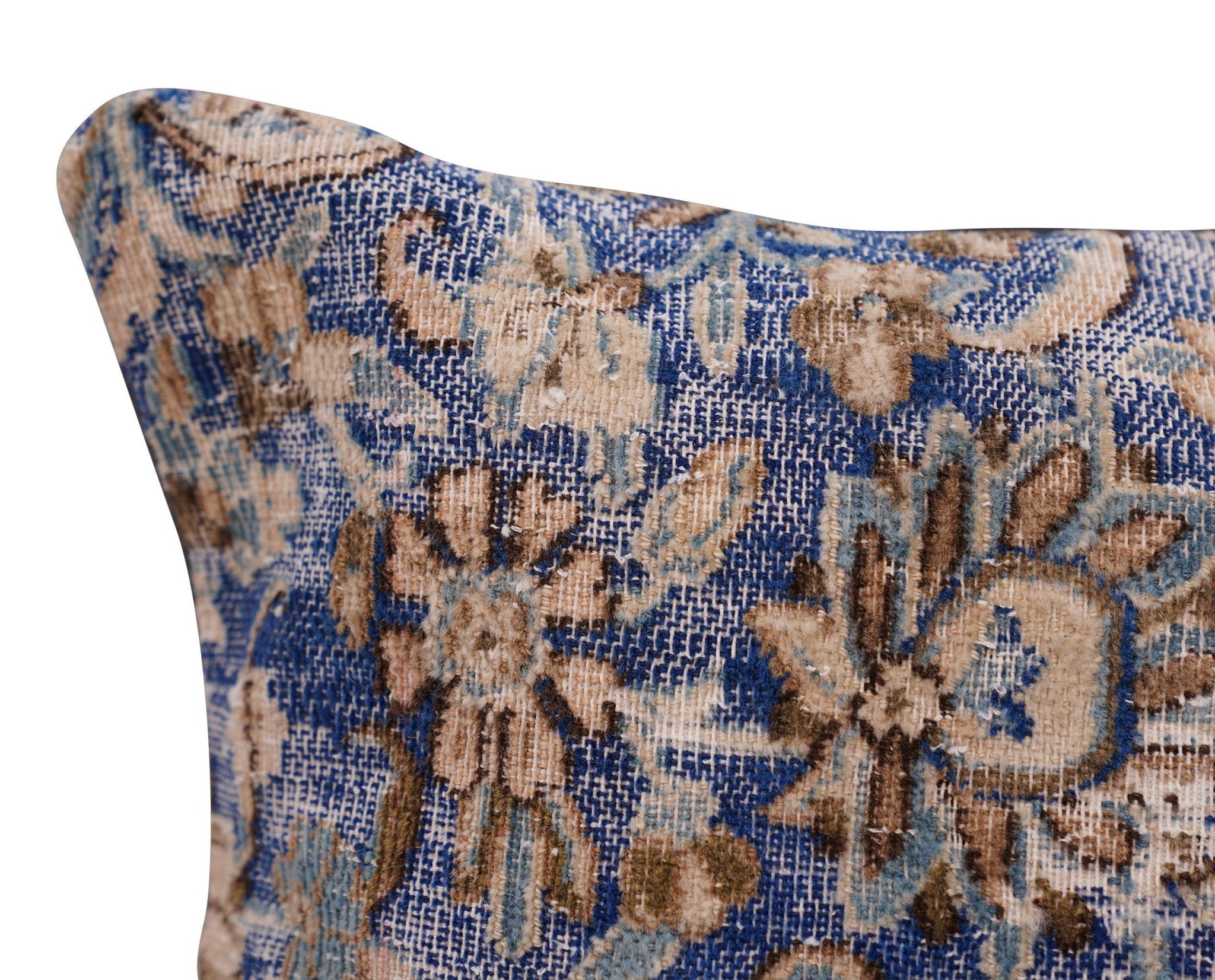Decorative pillow with floral pattern on a blue background