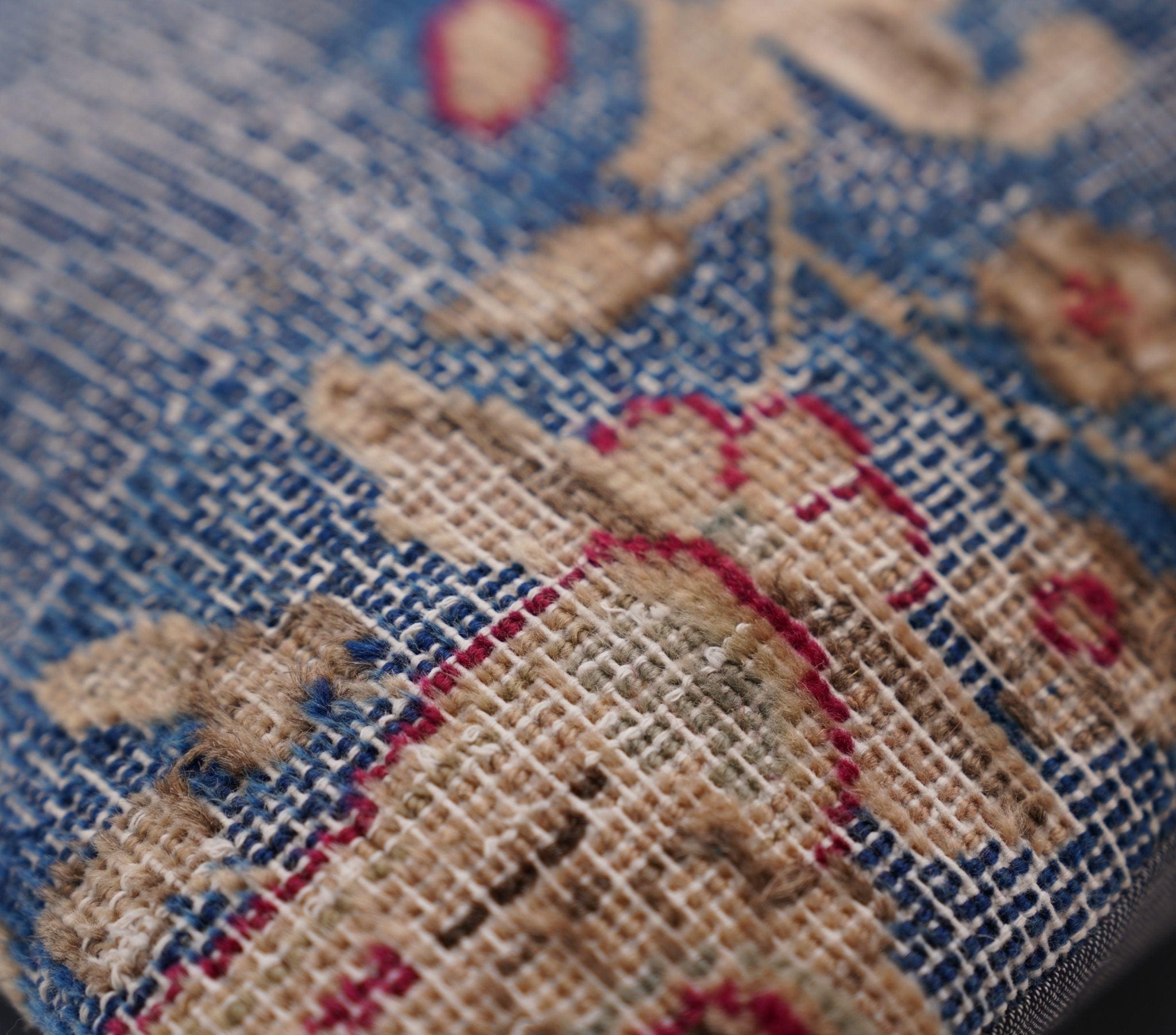 Close-up of a textured fabric with embroidered patterns