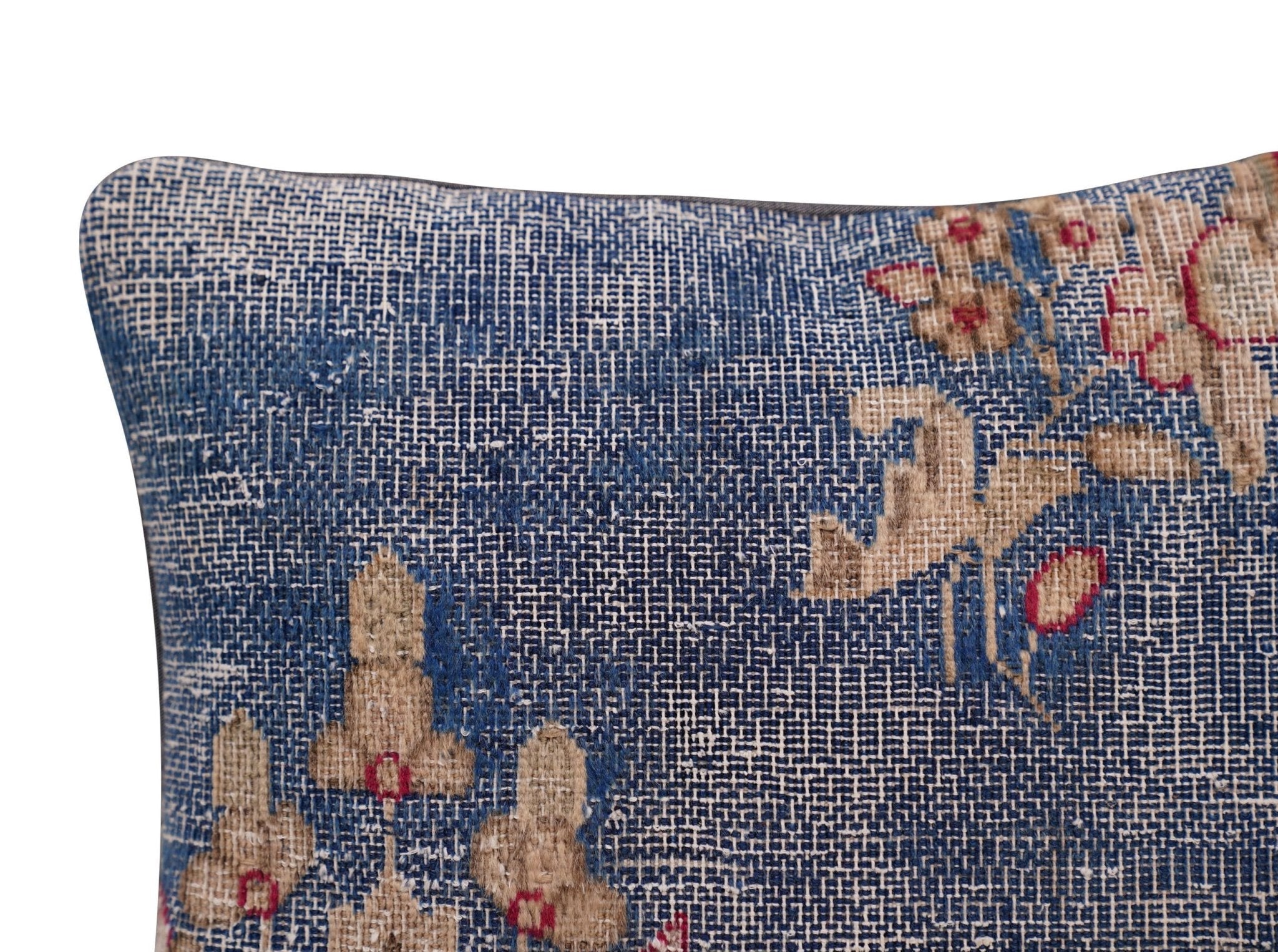 Decorative pillow with floral pattern on a blue background