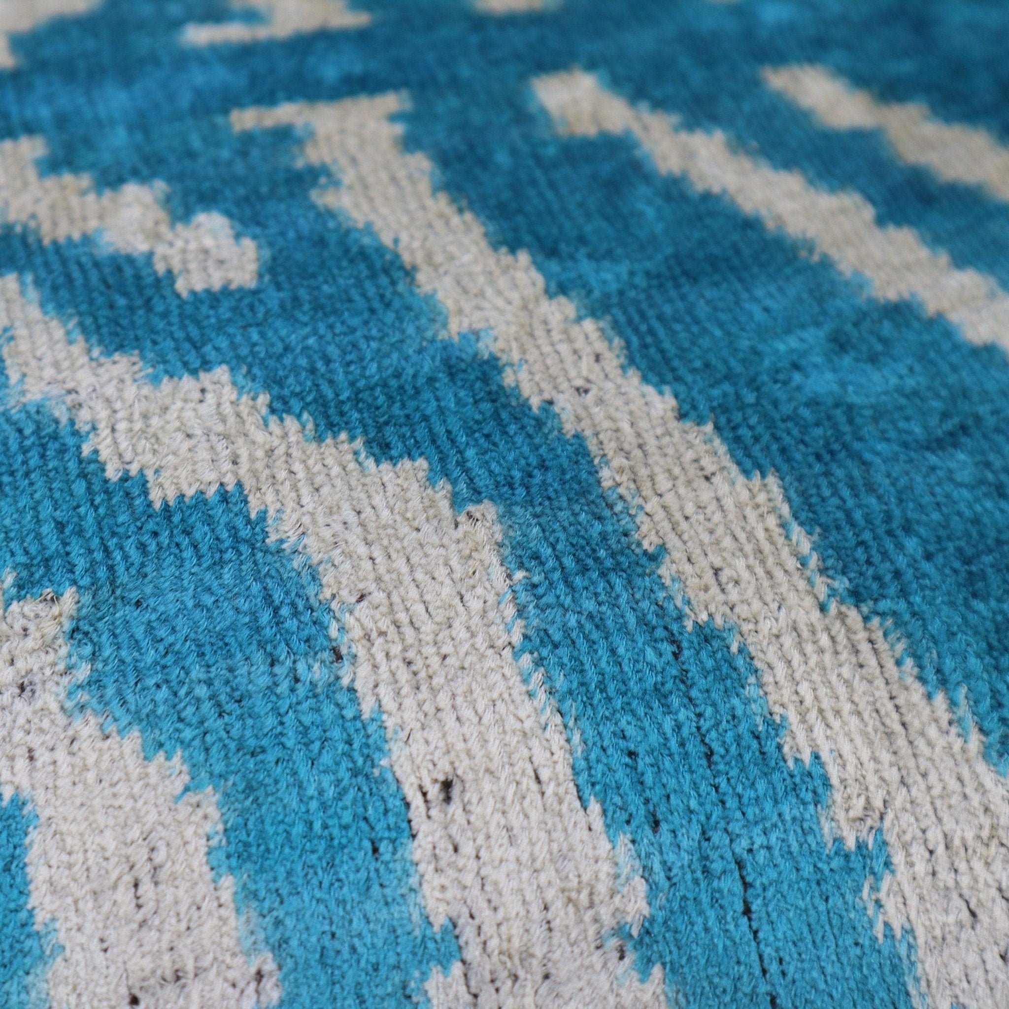 Close-up of a blue and gray patterned rug