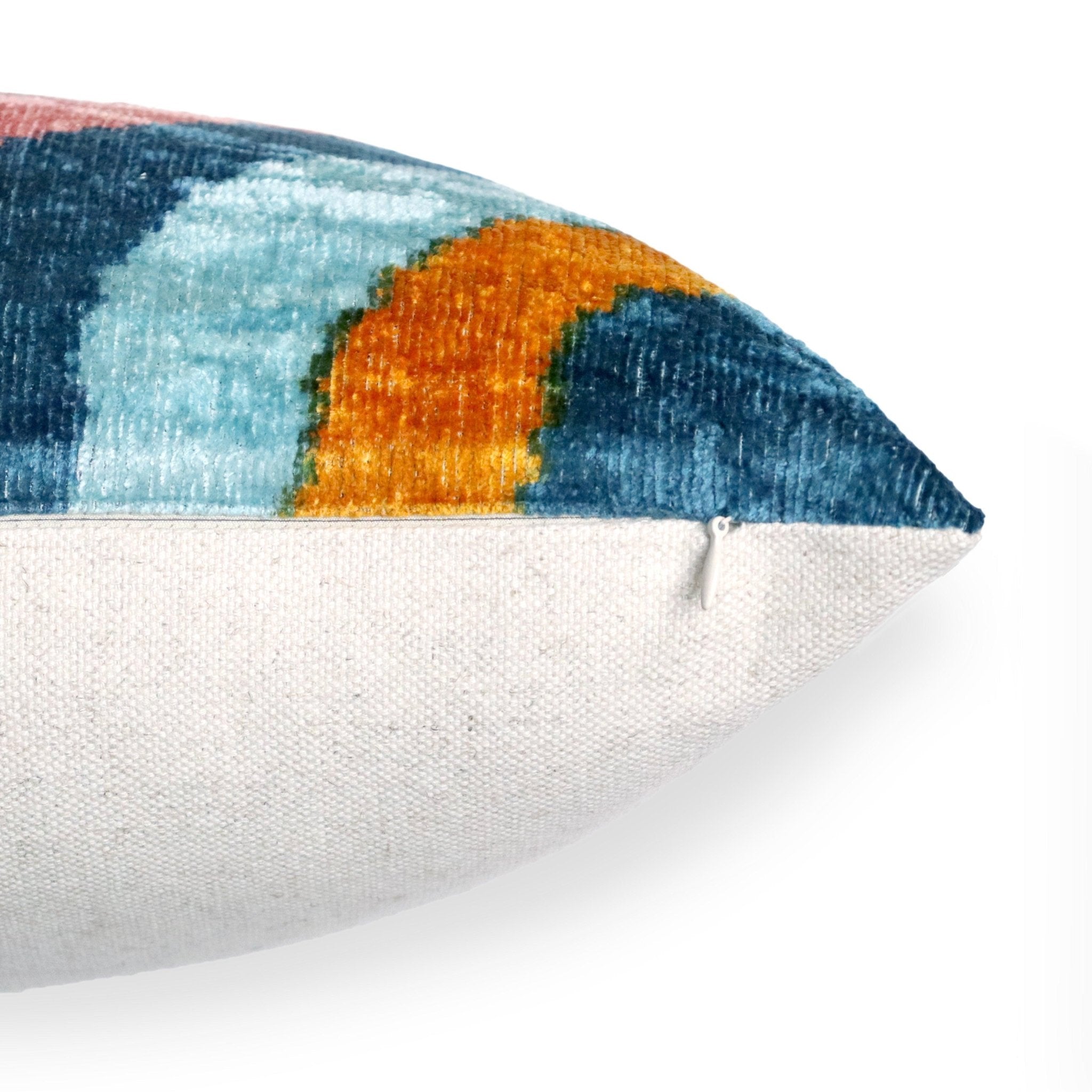 Colorful pillow with geometric pattern on a white background